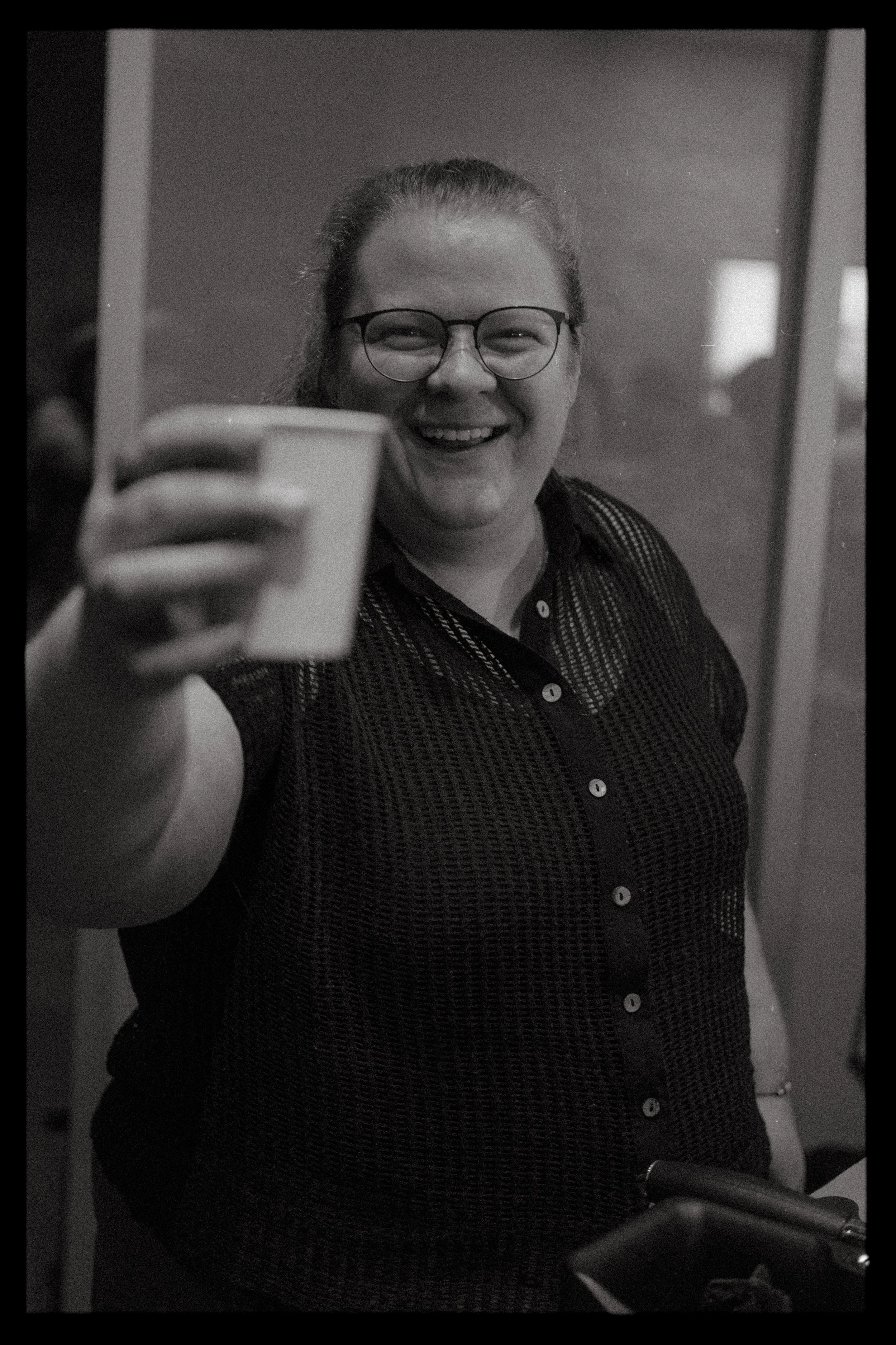 Guests enjoying made-to-order lattes and cappuccinos from our mobile coffee bar at a private event.