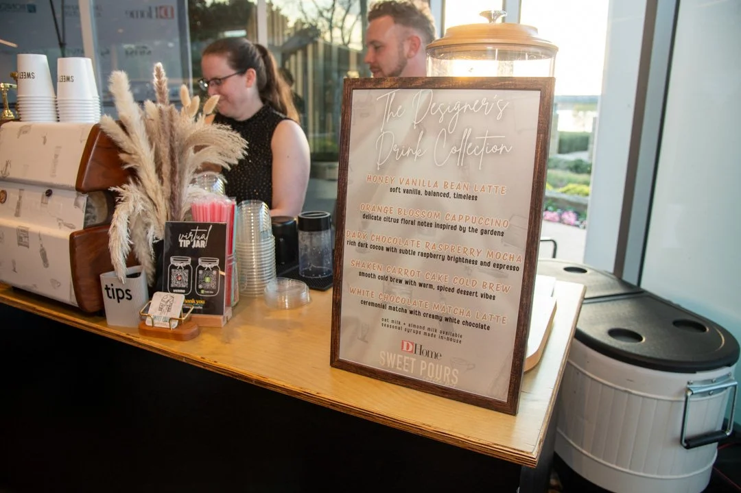 A custom-branded coffee cart activation designed to match the look and feel of a brand event.