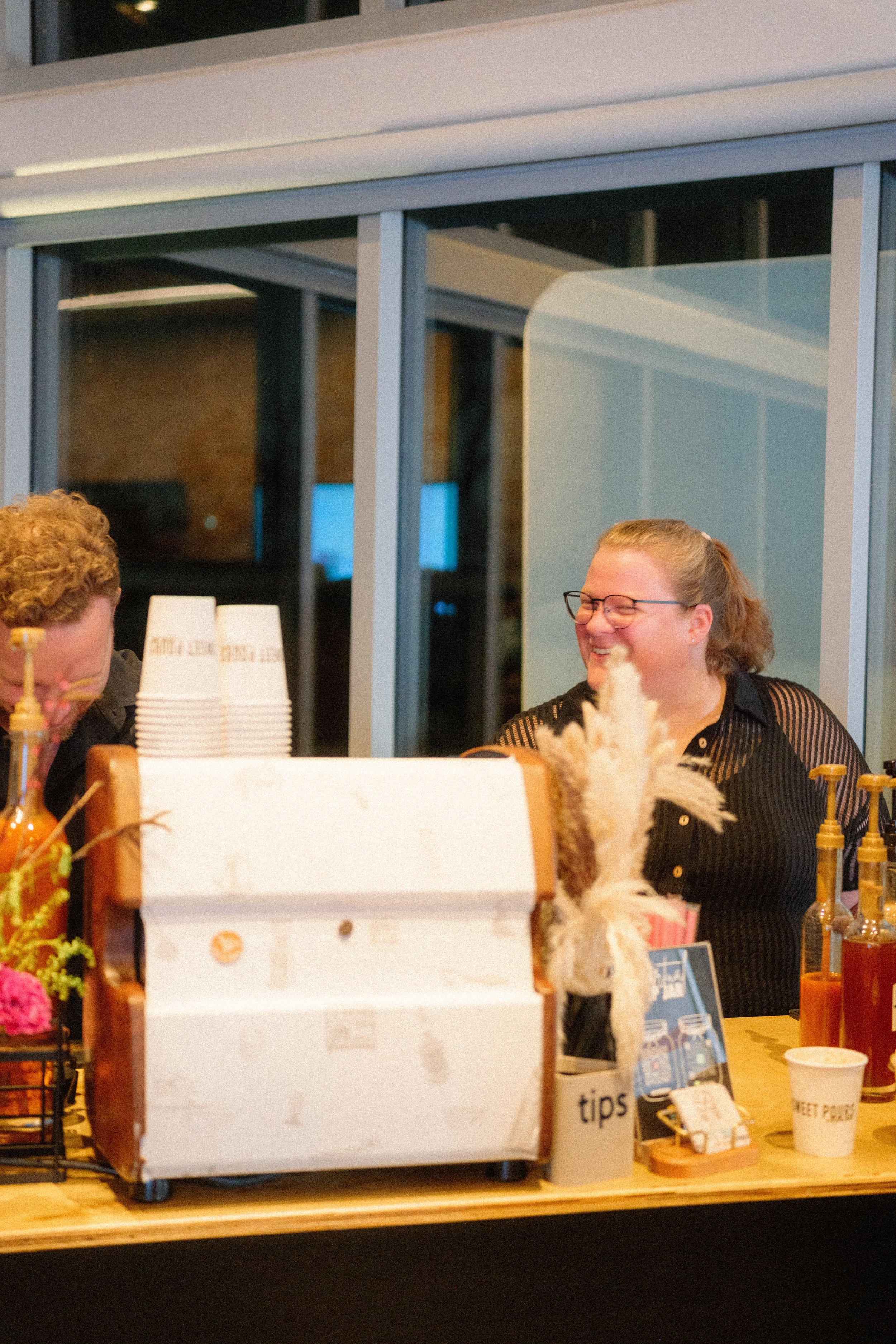 Our barista preparing specialty coffee drinks with premium beans and organic syrups.