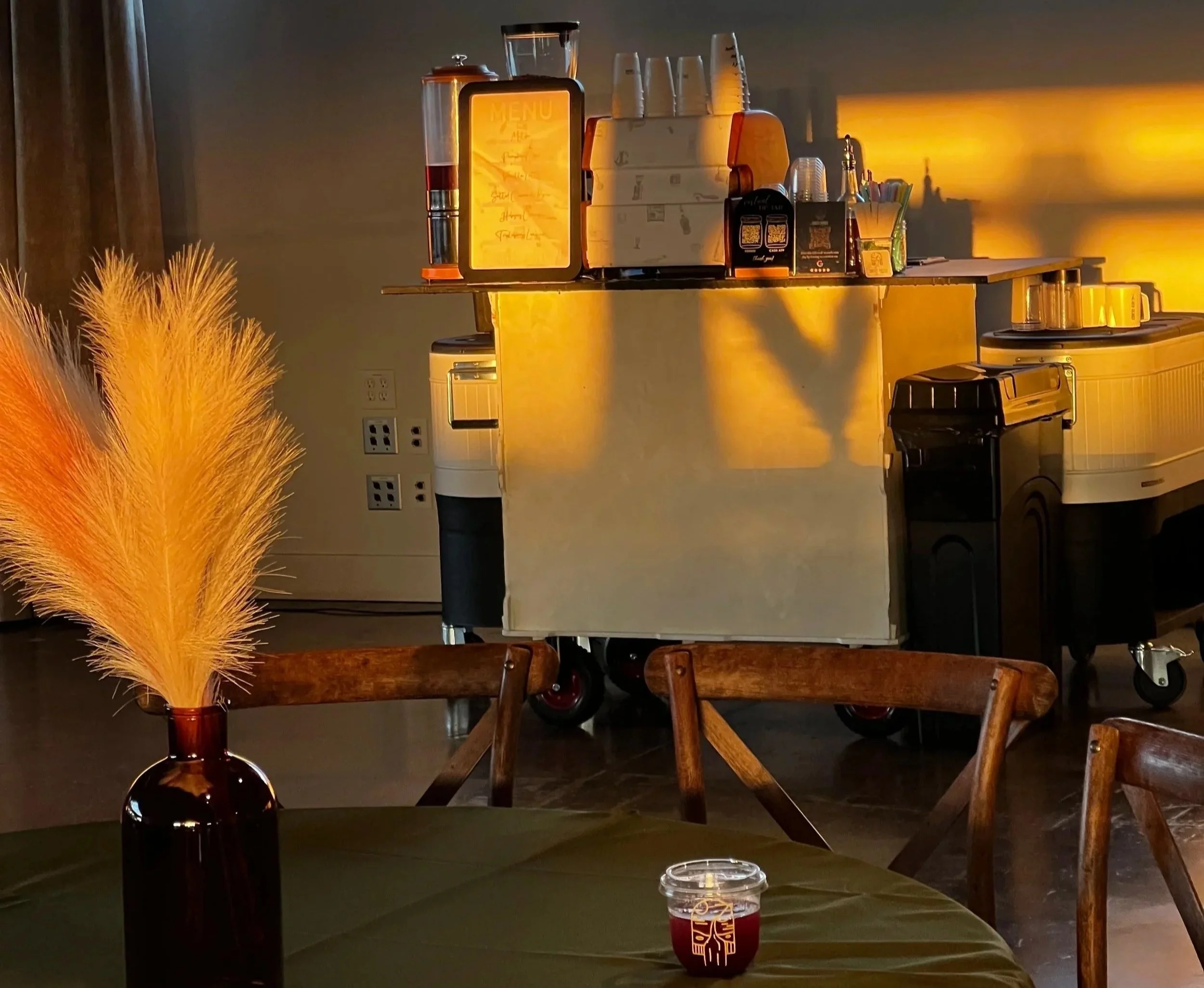 A clean, café-style espresso setup bringing fresh coffee service to an indoor event space.