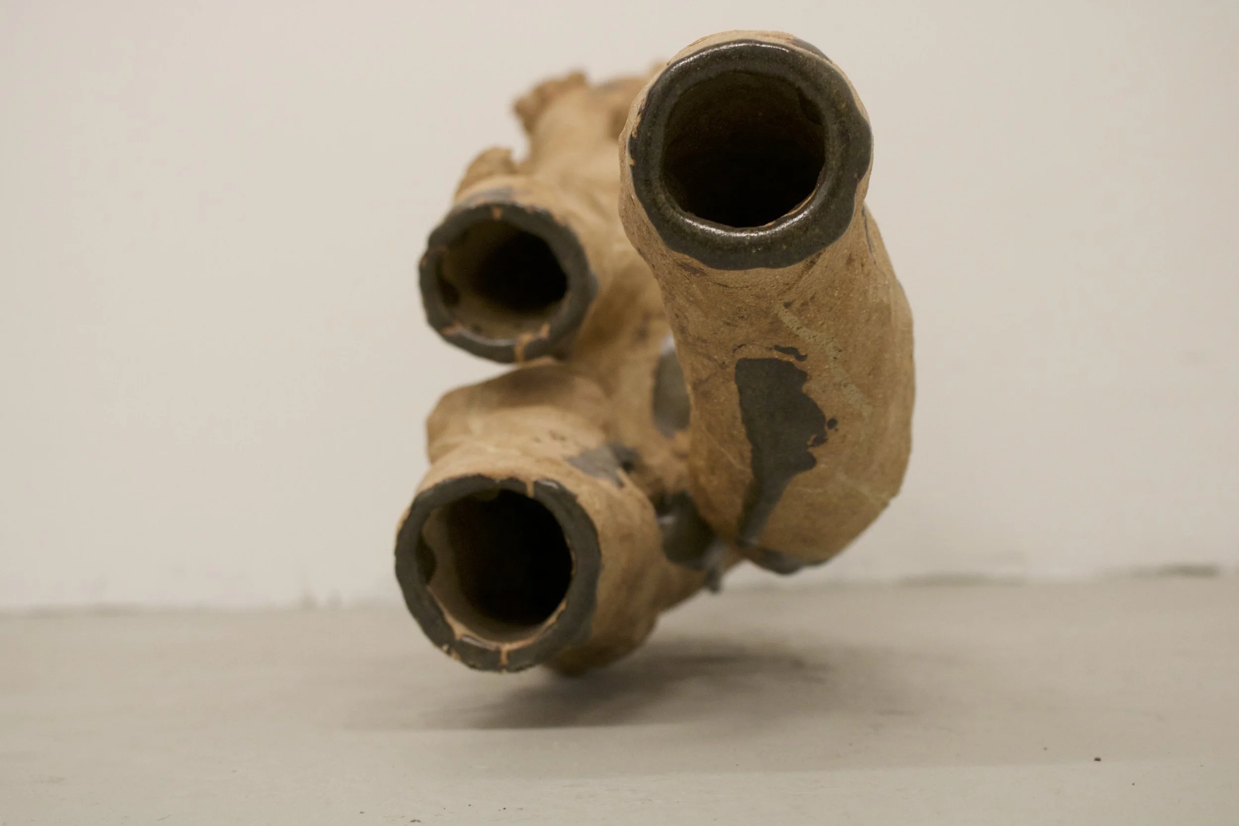 Reaching Out
(2025)
- Stoneware, glazed with found Chicago clay - 
50” x 13” x 19” 