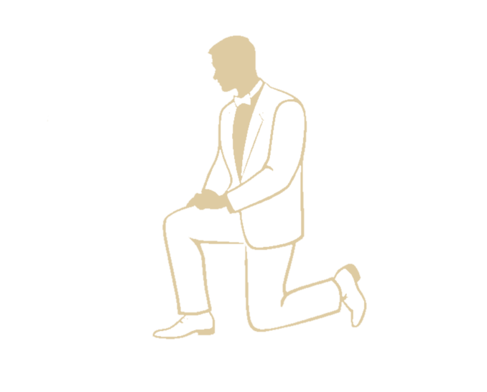 Silhouette of a man in a suit kneeling on one knee, with his hands resting on his raised leg, set against a black background.