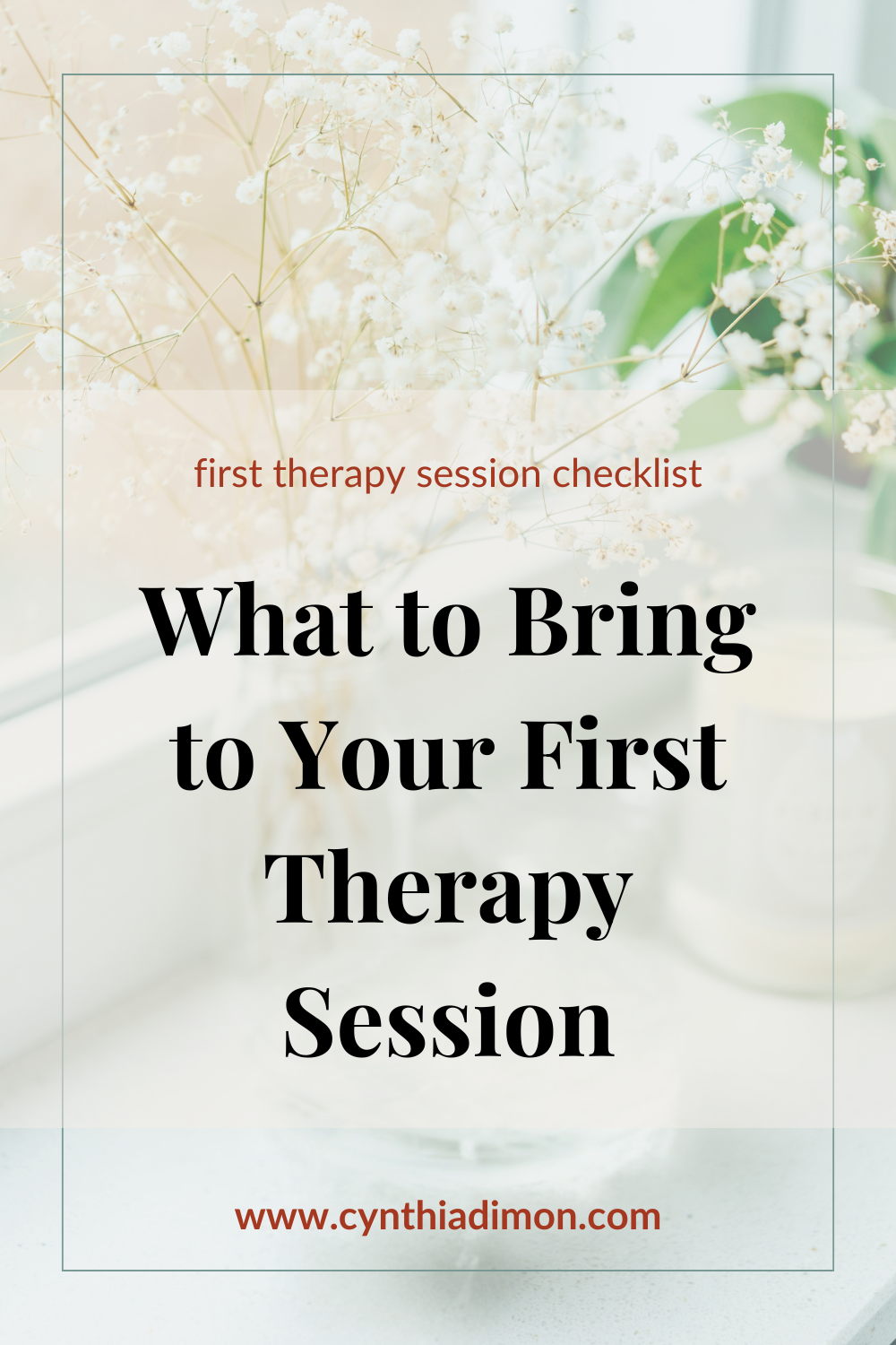 A soft-focus image of white baby's breath flowers in a clear glass vase on a light-colored surface, with a blurred background.