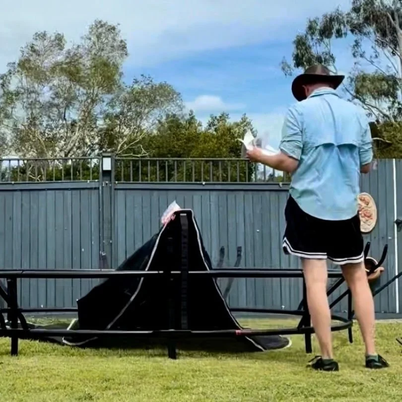 Even the pros should be checking the instructions to make sure the trampoline is being put together properly