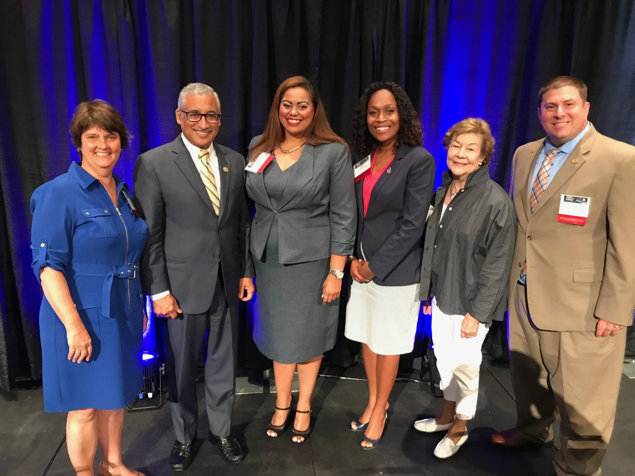 Dr. Samuel poses with U.S. House of Representatives Education and Workforce Chair Bobby Scott (middle left), VA Department of Education former Director of Community Engagement Leah Walker (center left), and conference panelists.