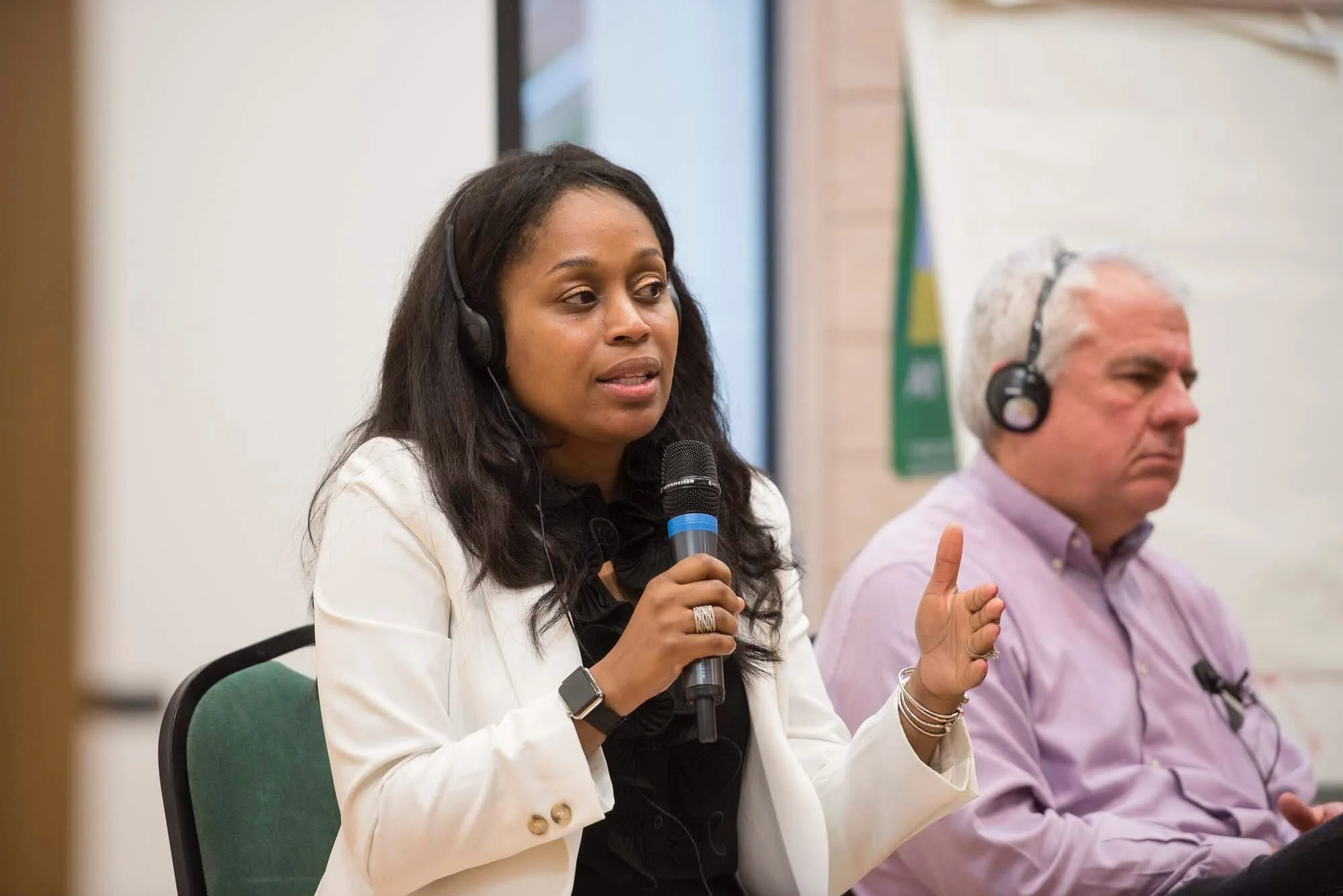 Dr. Samuel presenting (via translator) on U.S. education policy at Oxford University.