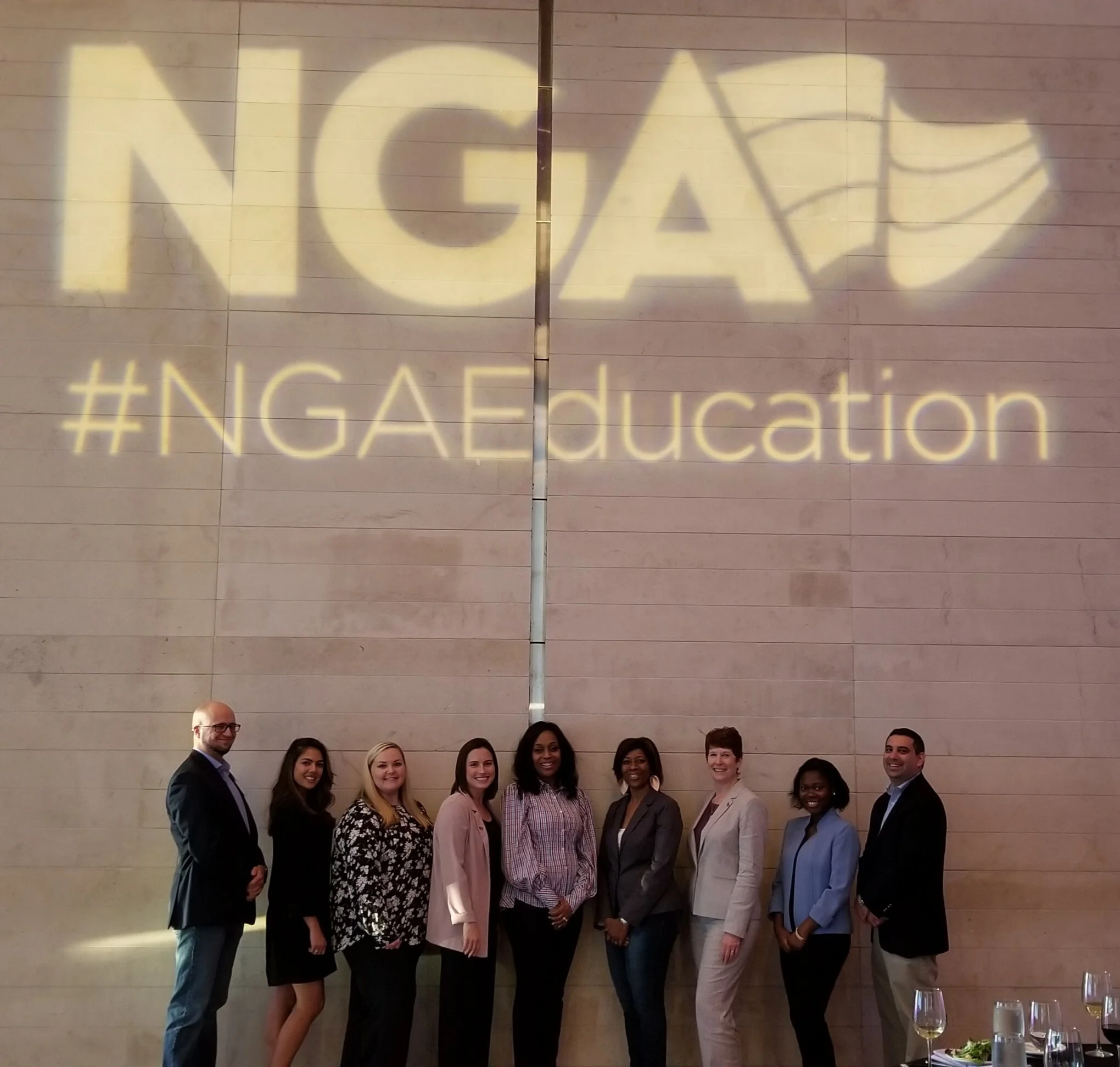 Dr. Samuel and the NGA Education team at a dinner at the Clinton Presidential Library.