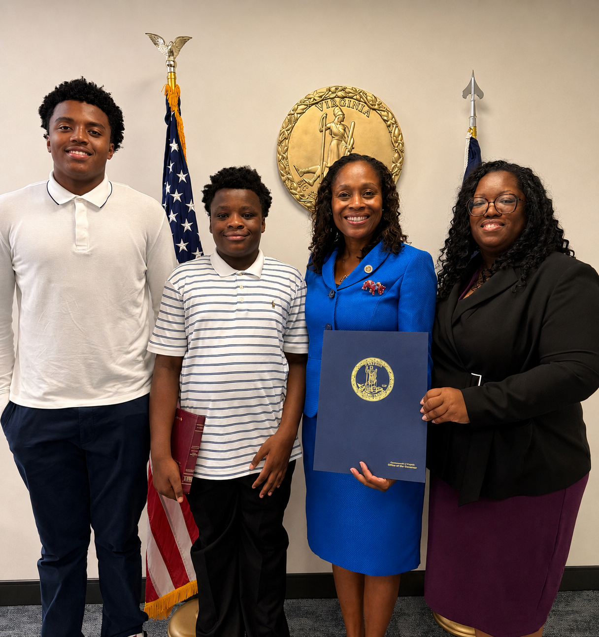 Dr. Maxwell and her sons during the Virginia Board of Education appointment ceremony.