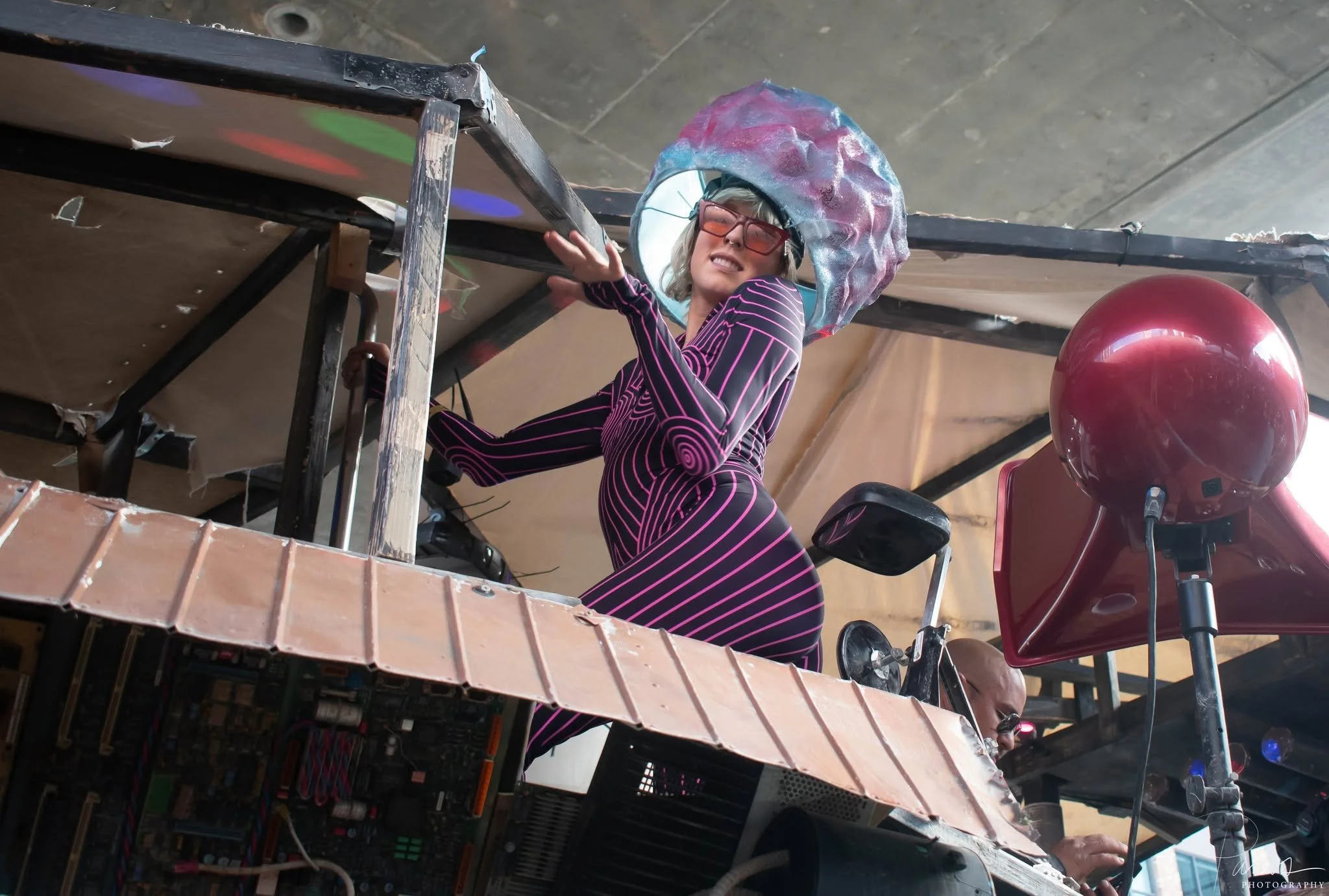 Costumed performer above the crowd at the How Weird Street Faire in San Francisco.