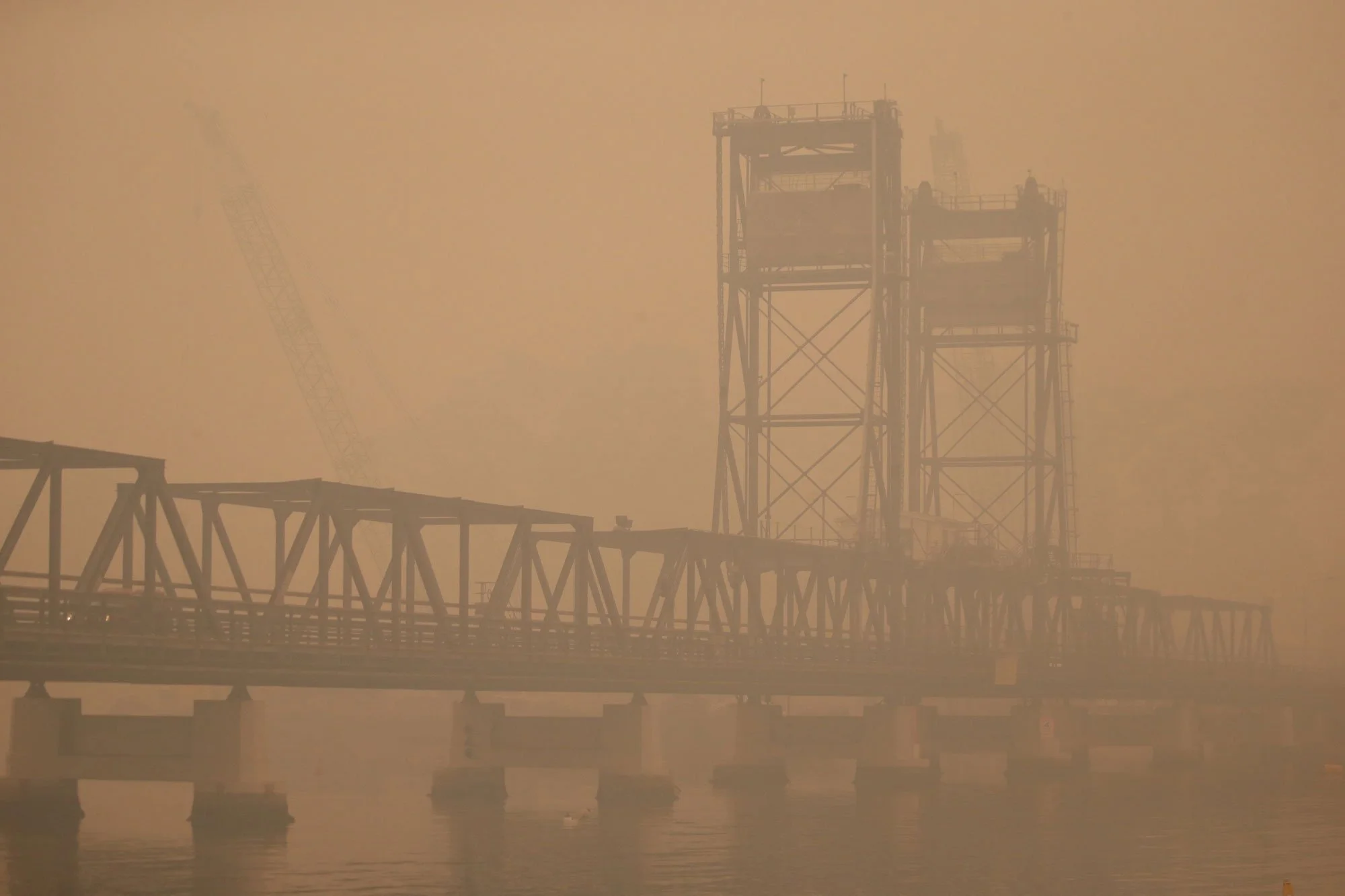  Bateman’s Bay bridge obscured by fire smoke this morning.   Wednesday 1st January 2020. Guardian Australia. 