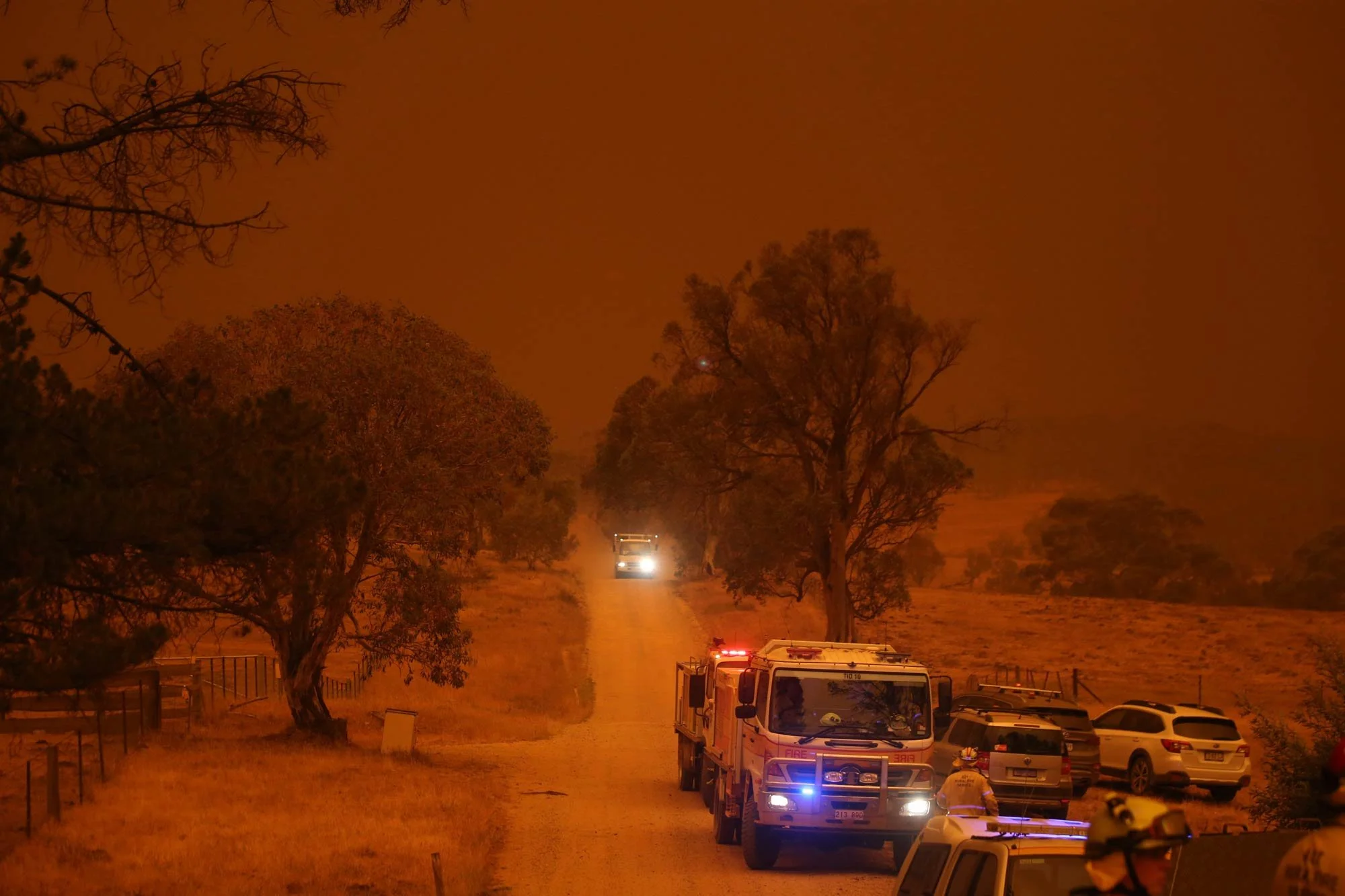  Day turns to night along the Yauok Road North of the town of Adaminaby as the fire front approaches.   Saturday 4th January 2020. Guardian Australia. 