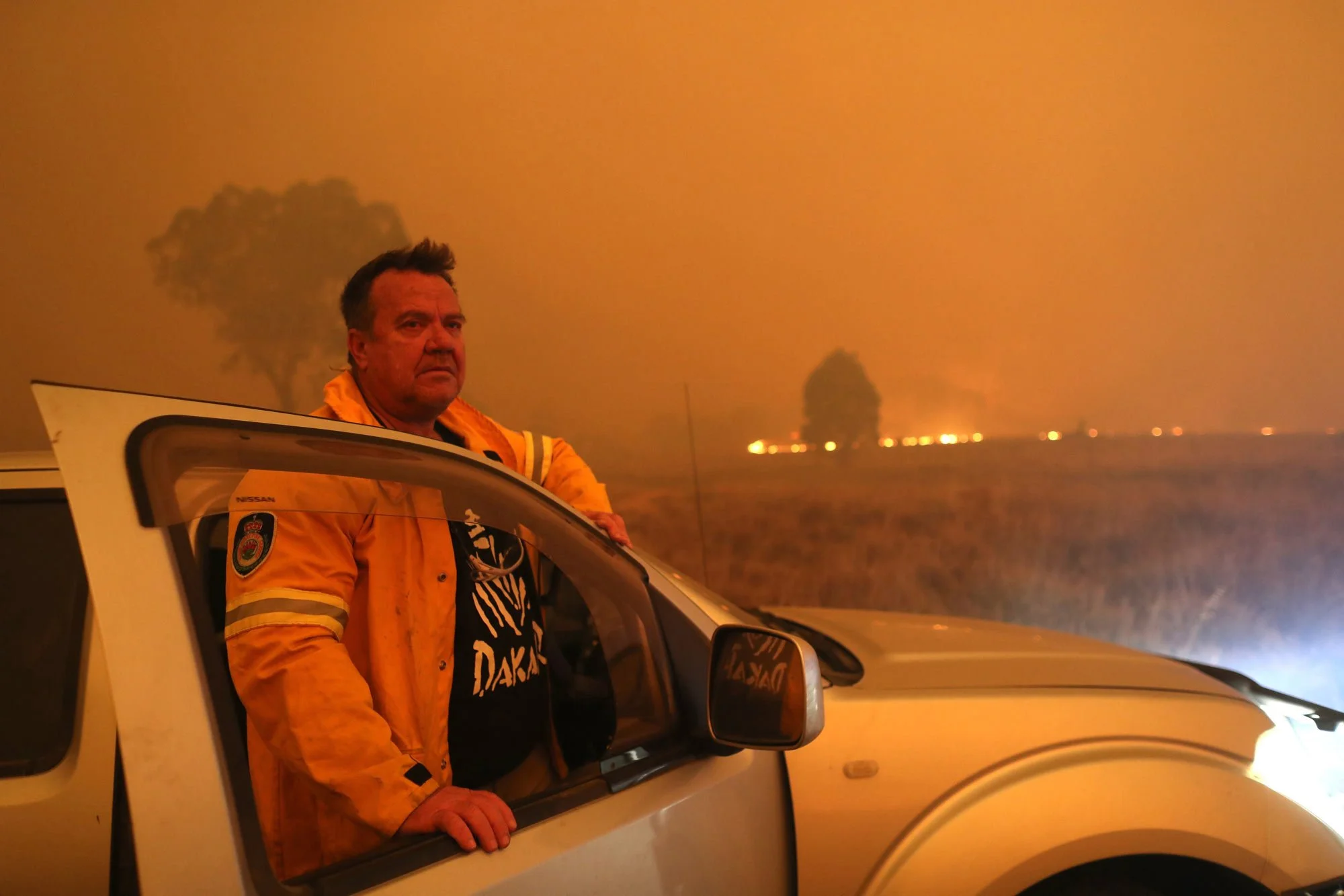  Laurence Cowie watches as fire approaches Tallabrook lodge a property along the Bumbalong Road North of Bredbo.   Saturday 1st February 2020. Guardian Australia. 
