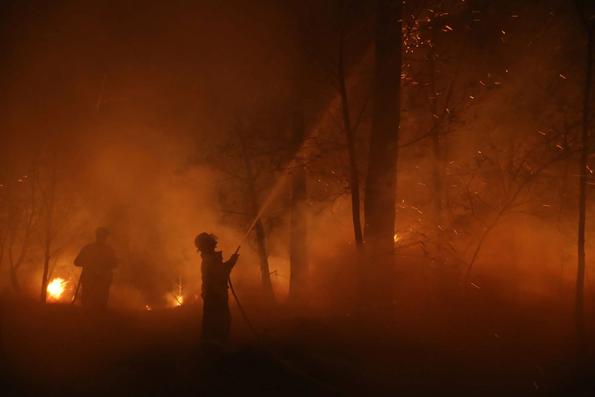  Horsley Park RFS Crew. The captain of Horsley Park Darren Nation amd firefighter a Daniel Knox defend a property near Potato Point on NSW South Coast.   Thursday 23rd January 2020. Guardian Australia. 