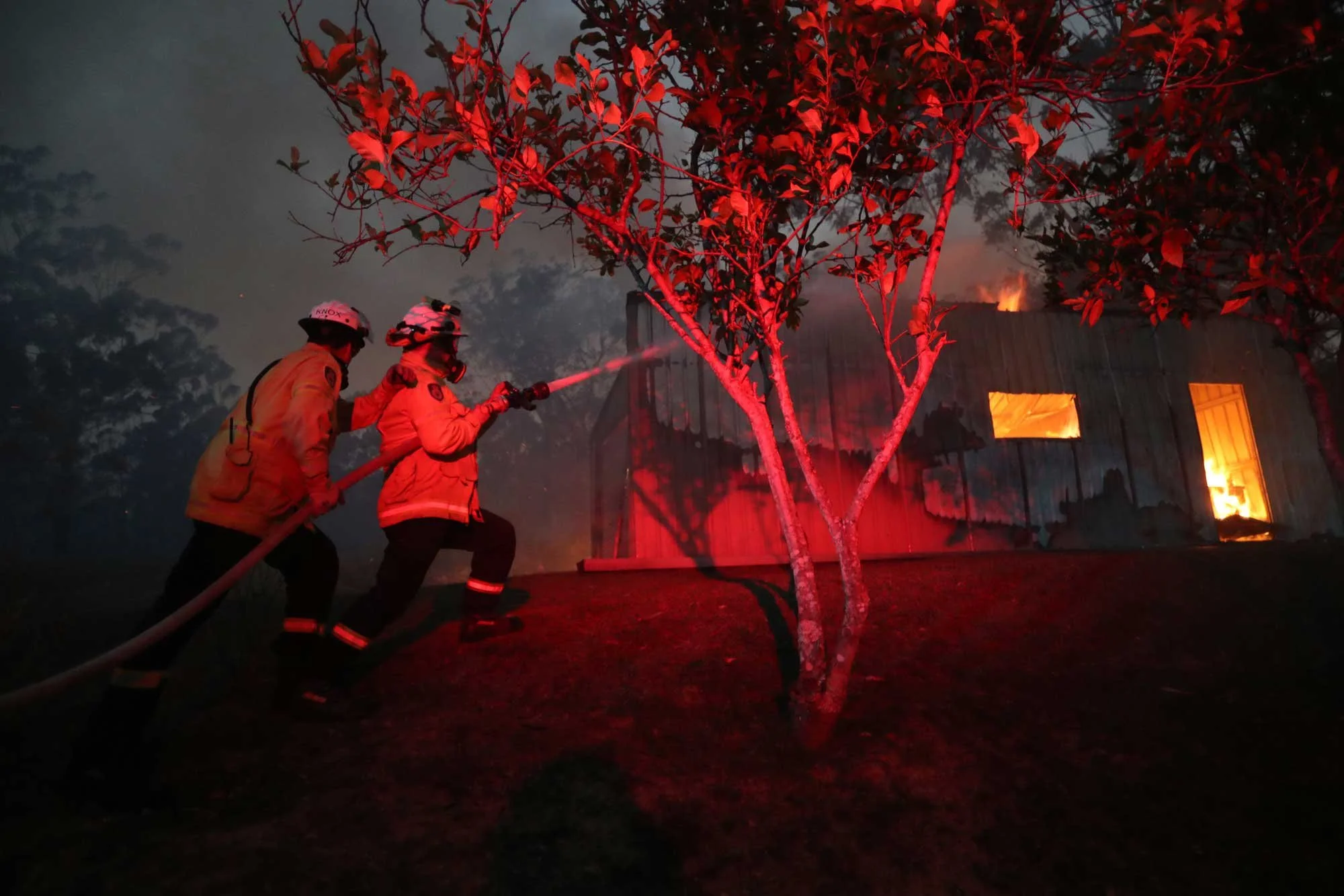  Horsley Park RFS Crew. The Horsley Park RFS crew extinguish a fire in a garage on a property near Potato Point on NSW South Coast.   Thursday 23rd January 2020. Guardian Australia. 