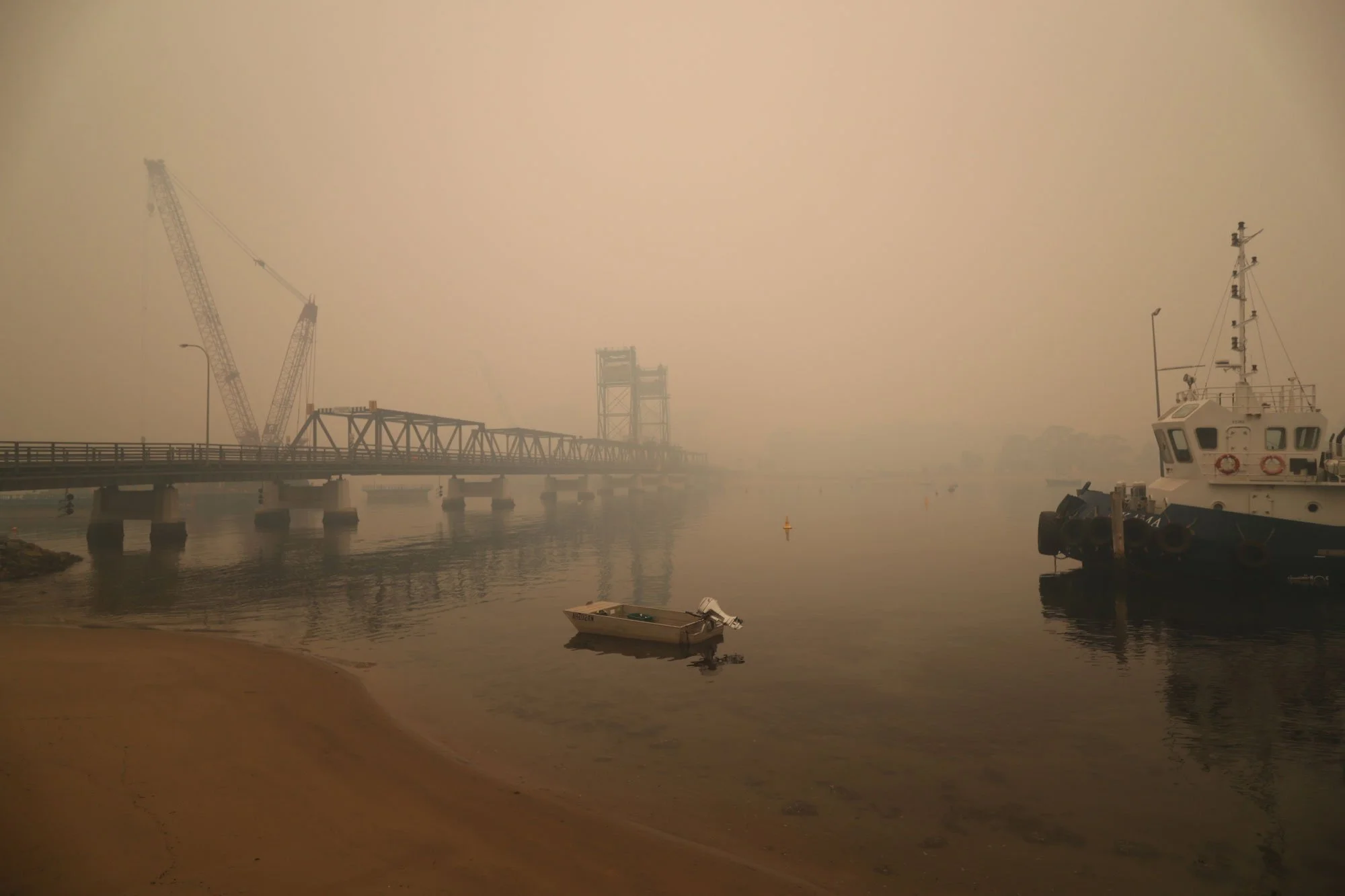  Bateman’s Bay bridge obscured by fire smoke this morning.   Wednesday 1st January 2020. Guardian Australia. 