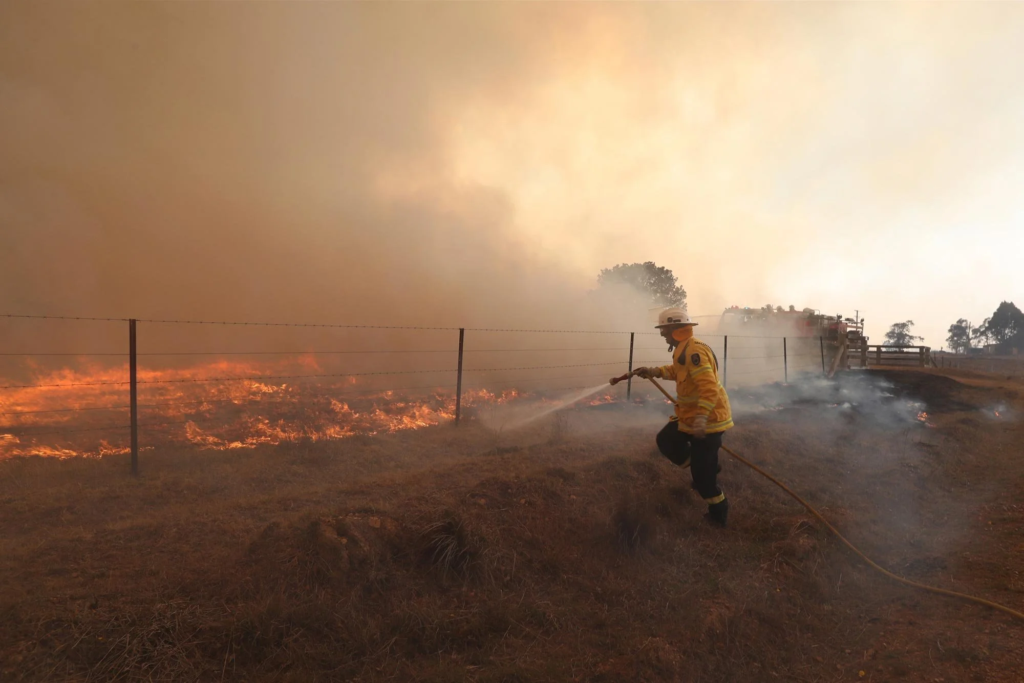  RFS crews put out spot fires ahead of the main fire front at the North Black Range, Palerang fire South of Braidwood this morning.   Sunday 1st December 2019. Guardian Australia. 