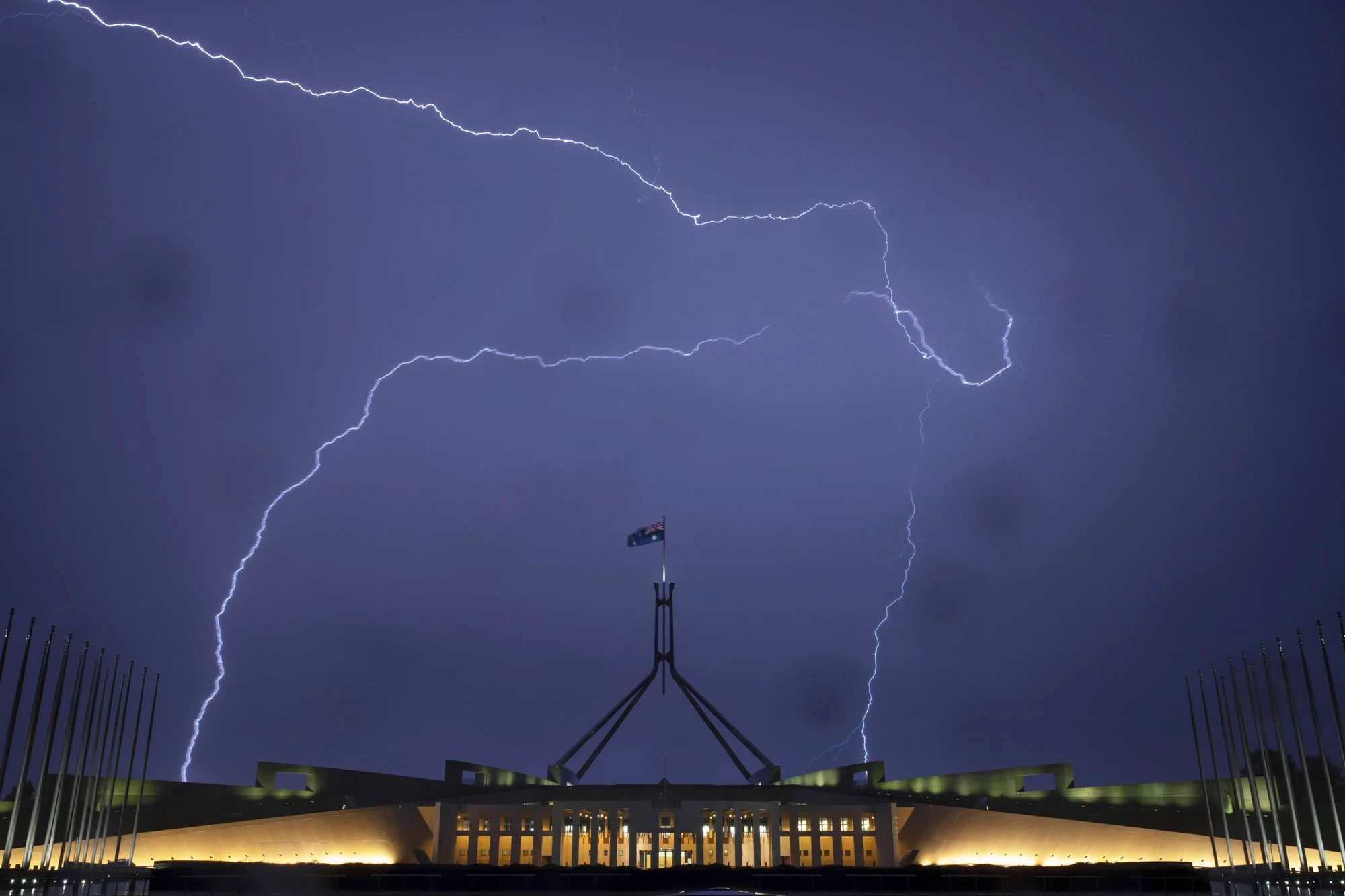 A thunderstorm passes over Parliament House Canberra