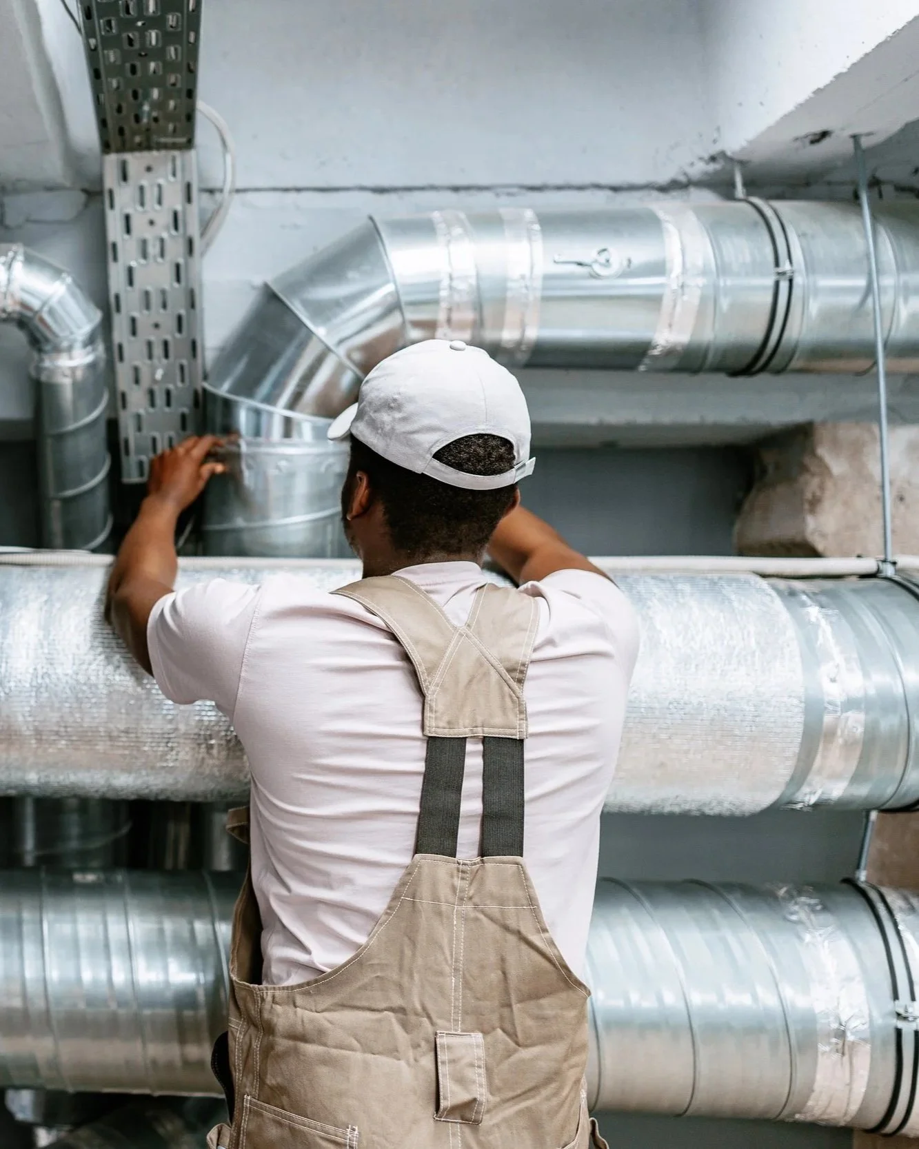 Precision ductwork installation in progress — ensuring efficient airflow and a reliable HVAC system for this commercial building.
