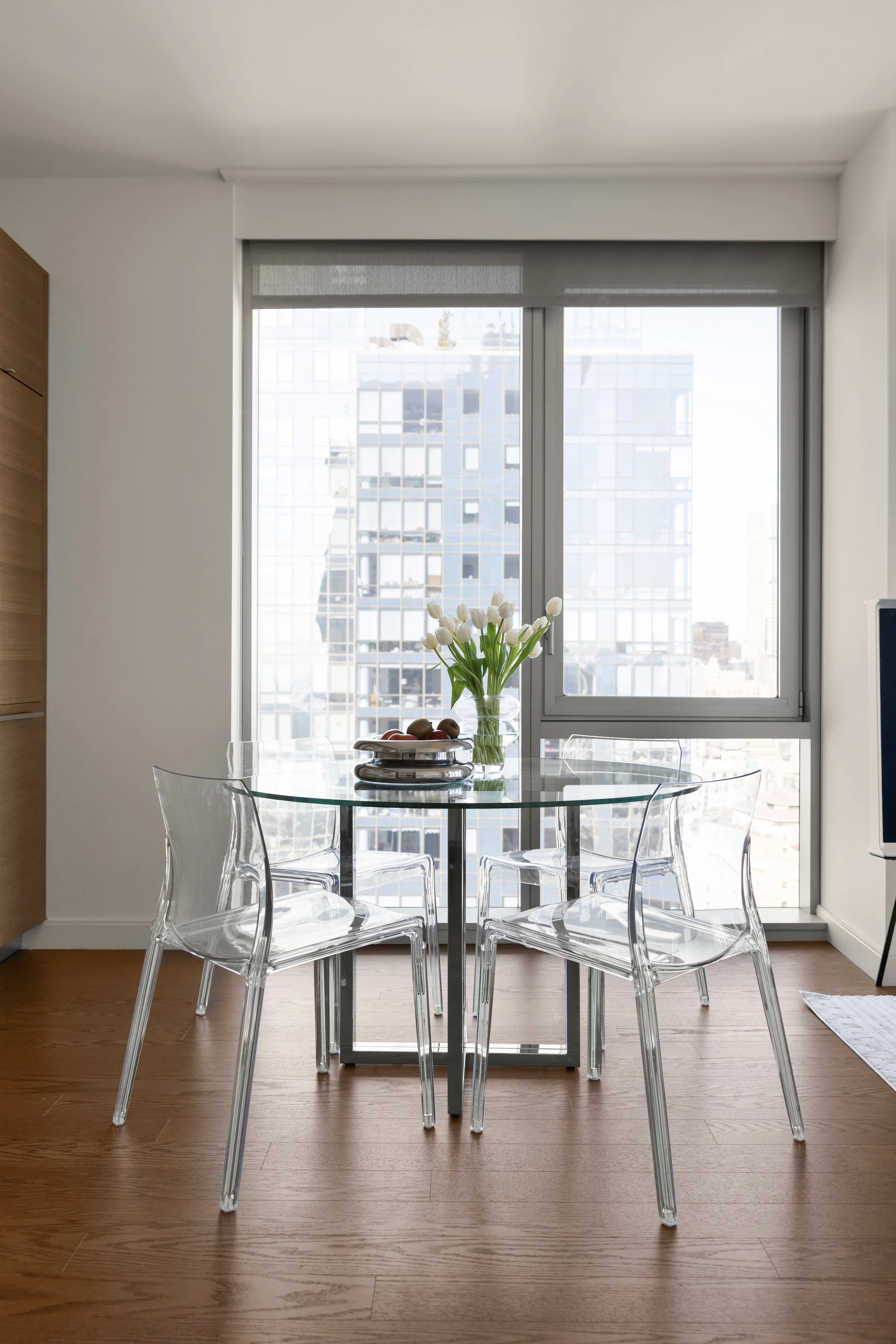 Refined Manhattan apartment interior with neutral tones, modern seating, and thoughtfully curated décor