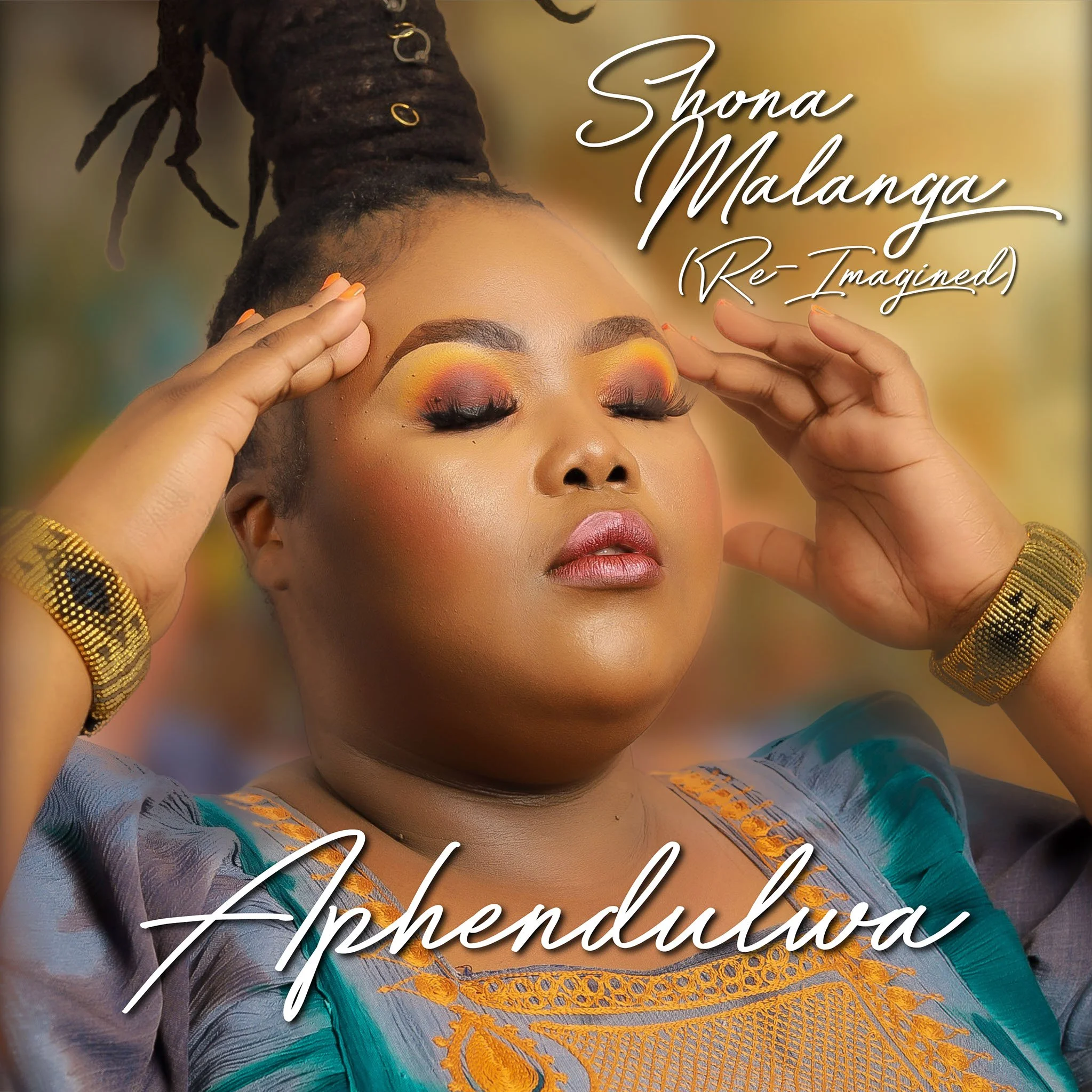 A woman with eyes closed, wearing vibrant makeup and traditional attire, touching her temples with both hands, with text overlay reading "Shona Malanga (Re-Imagined)" and "Aphendulwa."