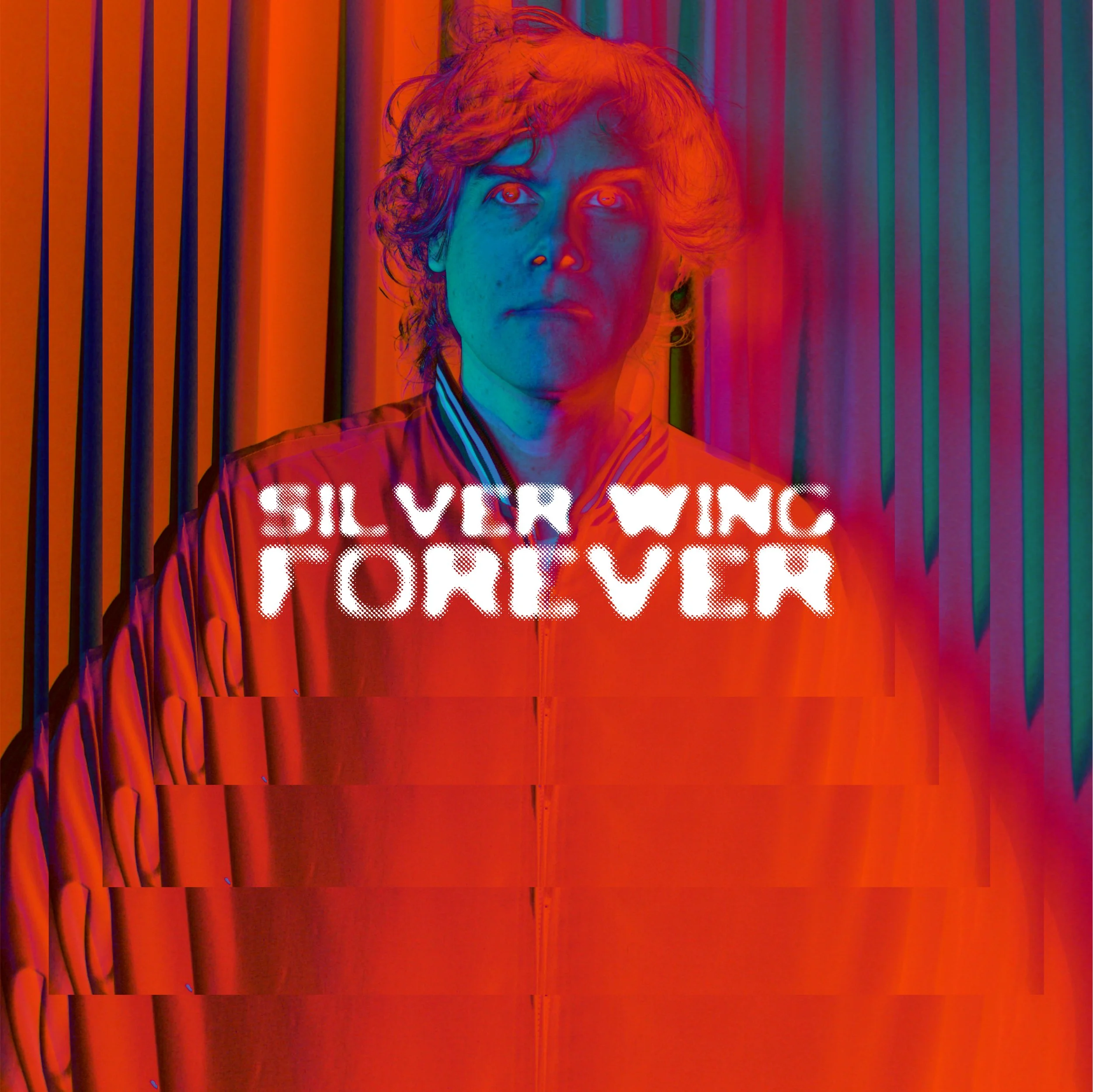 A person with curly hair wearing a varsity jacket standing in front of colorful curtains with distorted digital effects and overlay text that reads 'Silver Wing Forever'.