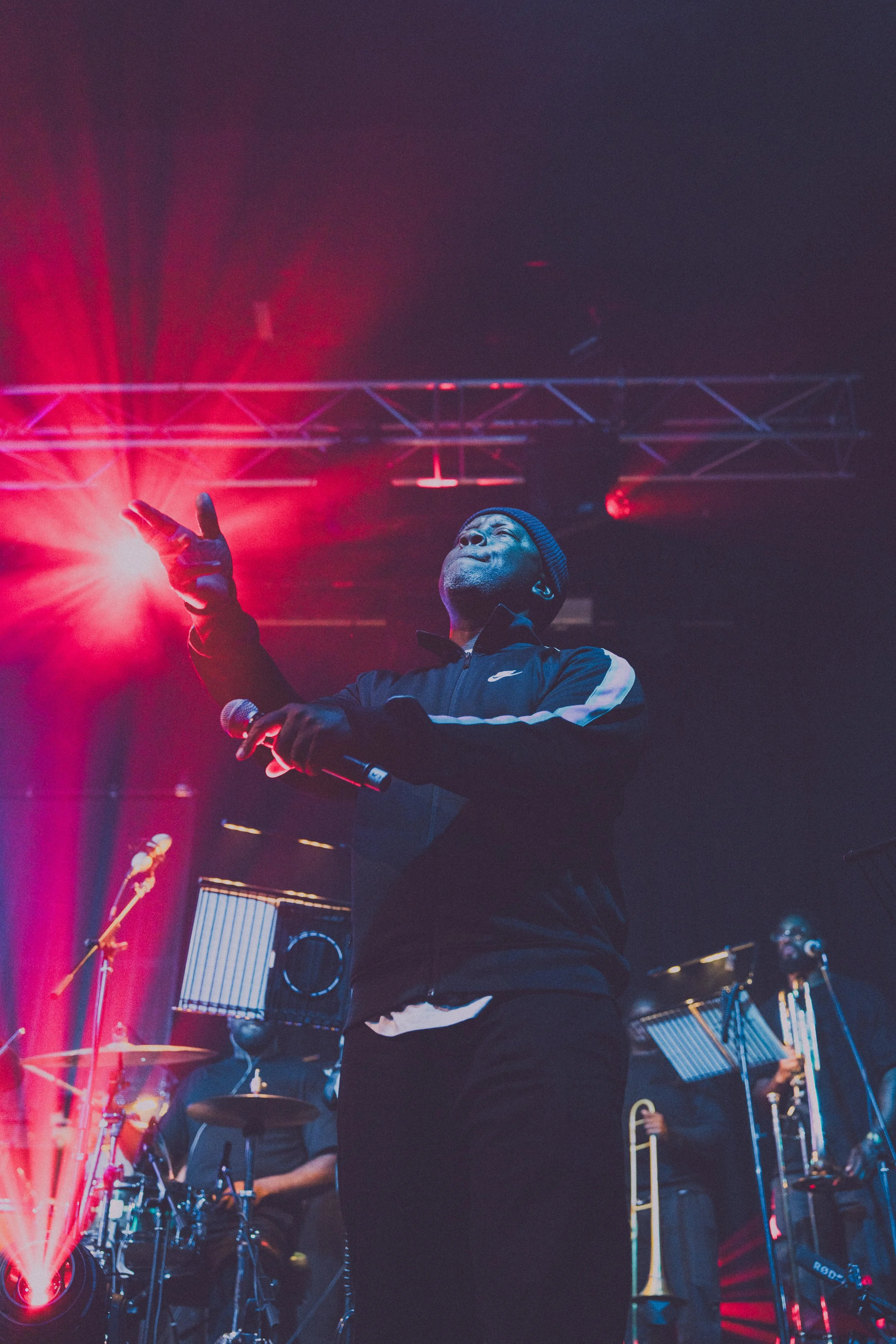 mc GQ on stage performing taken for his conduct magazine interview with Strategy