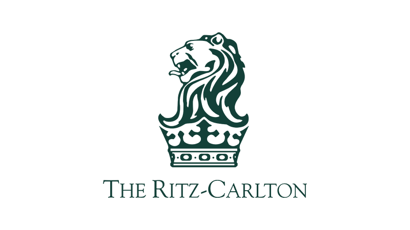 Logo of The Ritz-Carlton featuring a lion's head within a crown