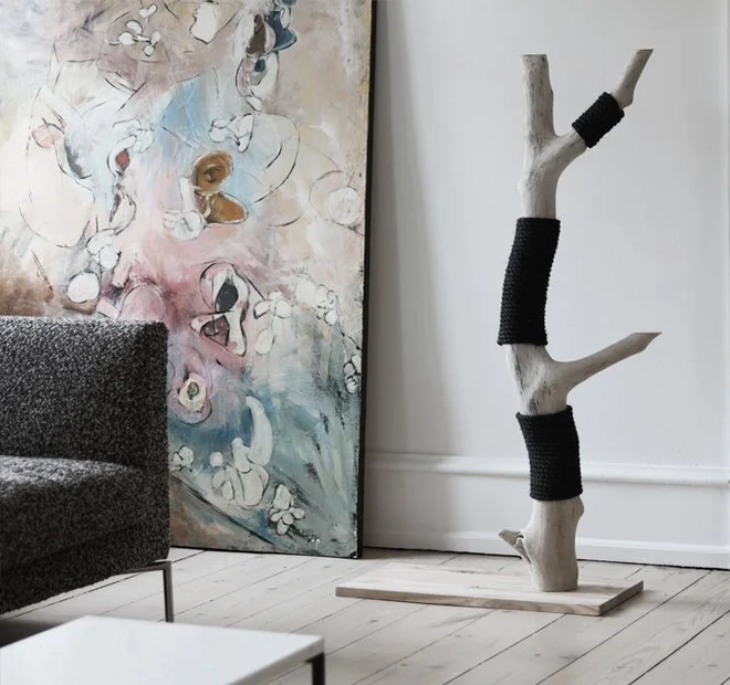 Sculptural designer cat furniture in wood and sisal integrated into a contemporary home interior