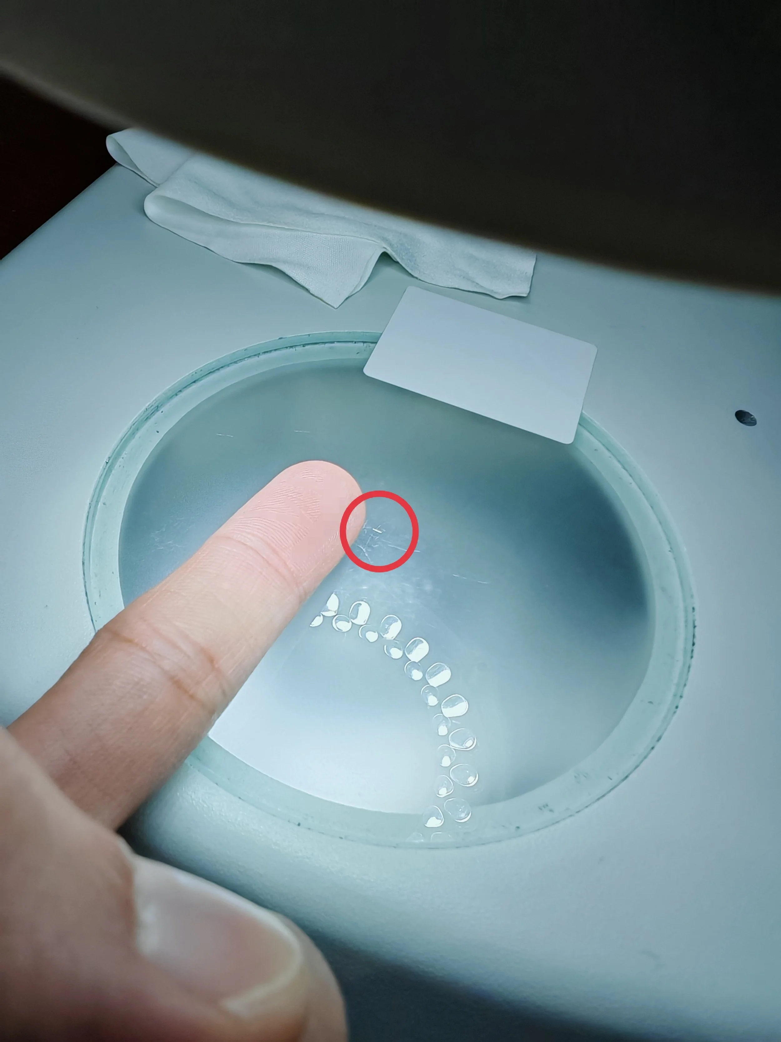 the size of a precision part in comparison to the size of a finger.