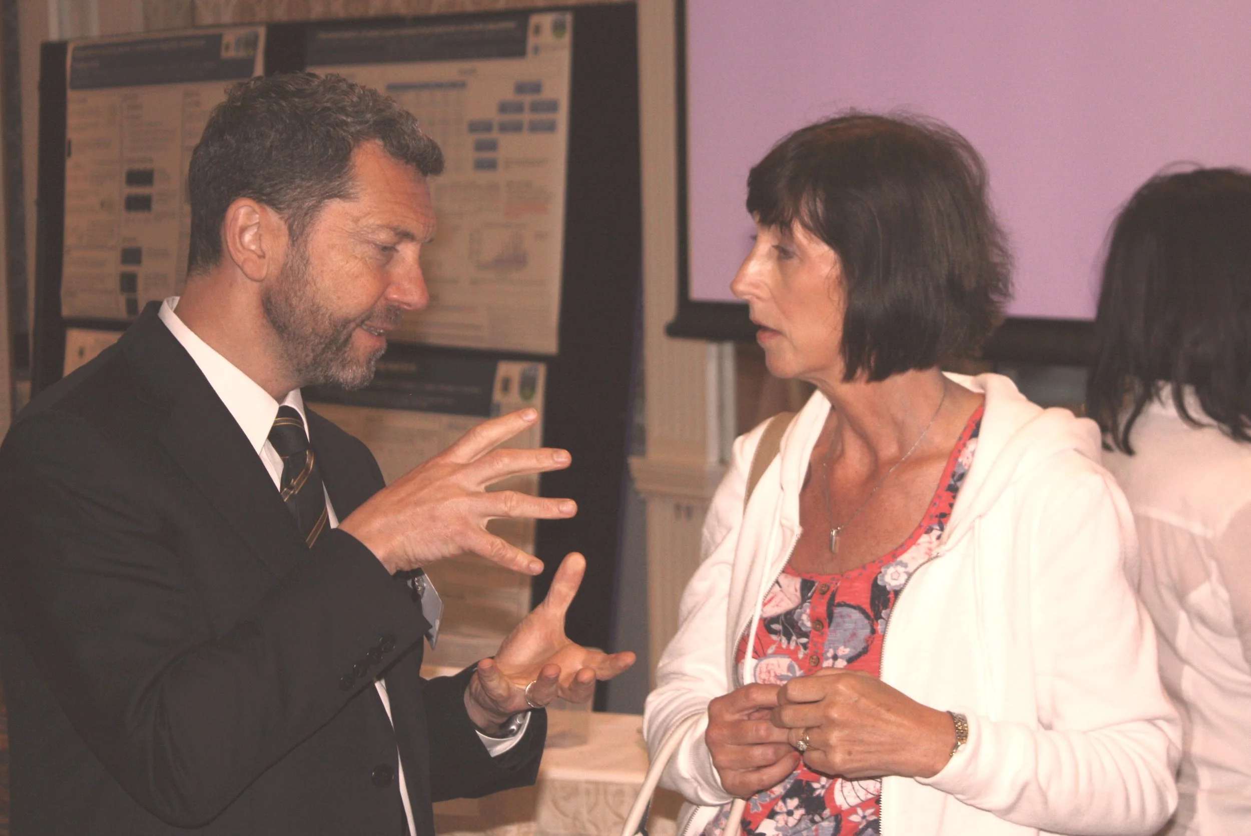 Professor Richard Reilly speaks to attendee at the Dystonia Ireland Conference, 2016