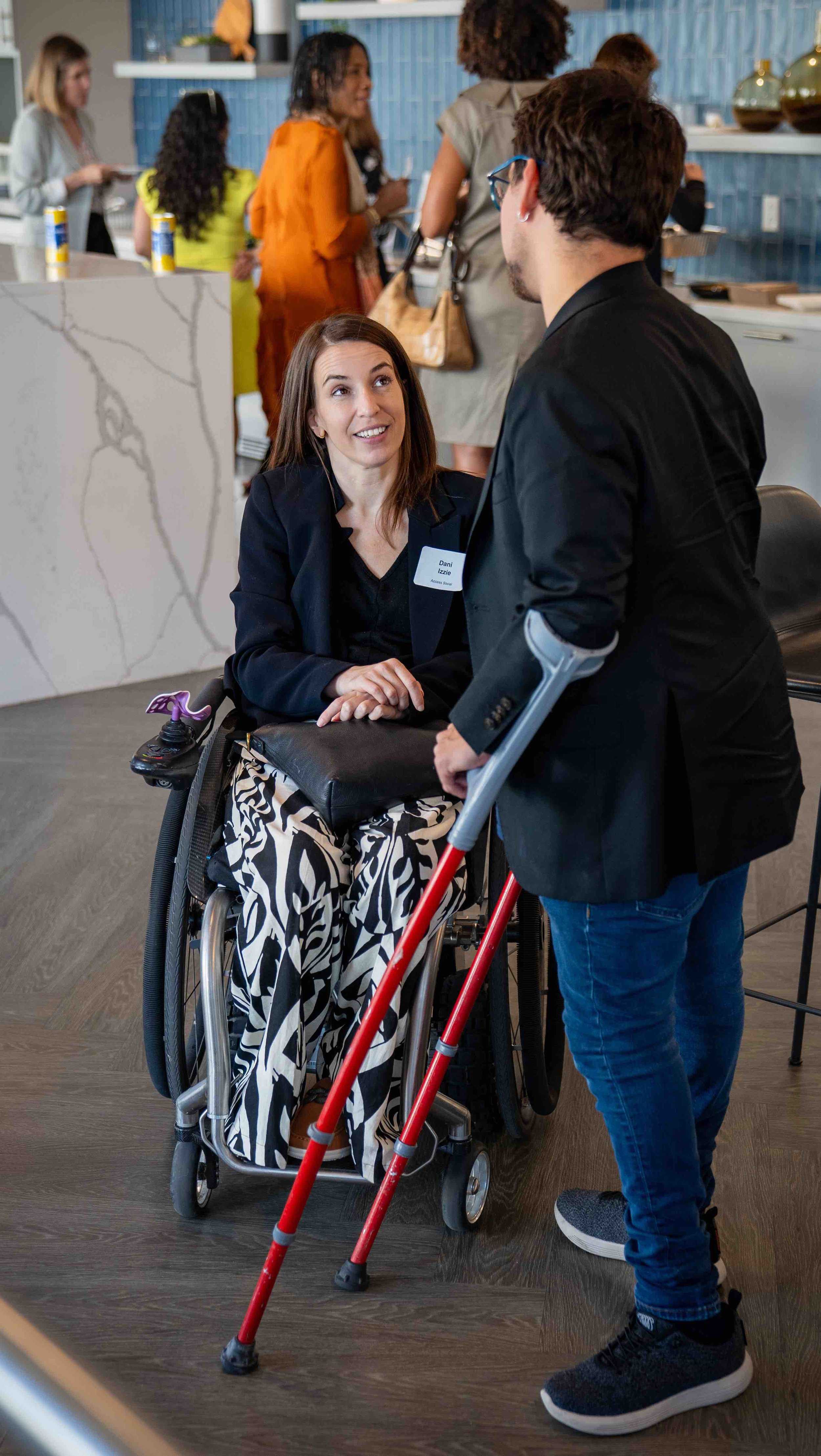Two individuals speaking at a networking event