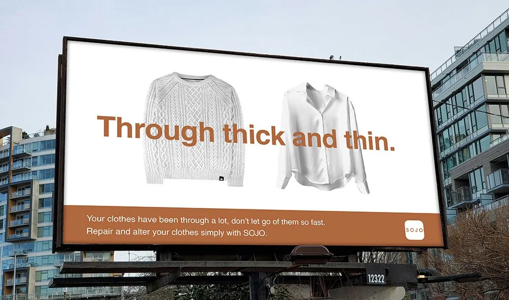 Billboard advertisement for SOJO clothing repair service featuring images of a thick knitted sweater and a thin blouse with text about repairing and altering clothes.