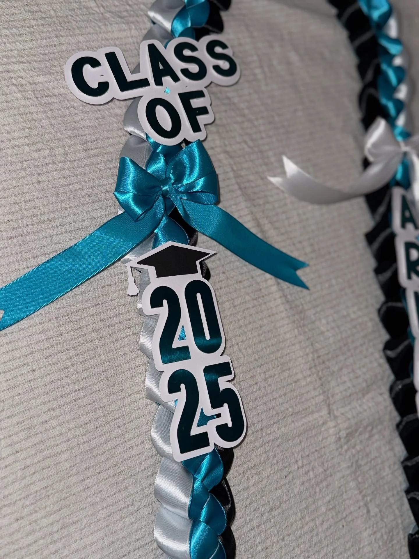 Get your personalized graduation leis now! A thoughtful gift that will delight your grad for years to come! #graduation #lei #coralreef #cuda #classof2025