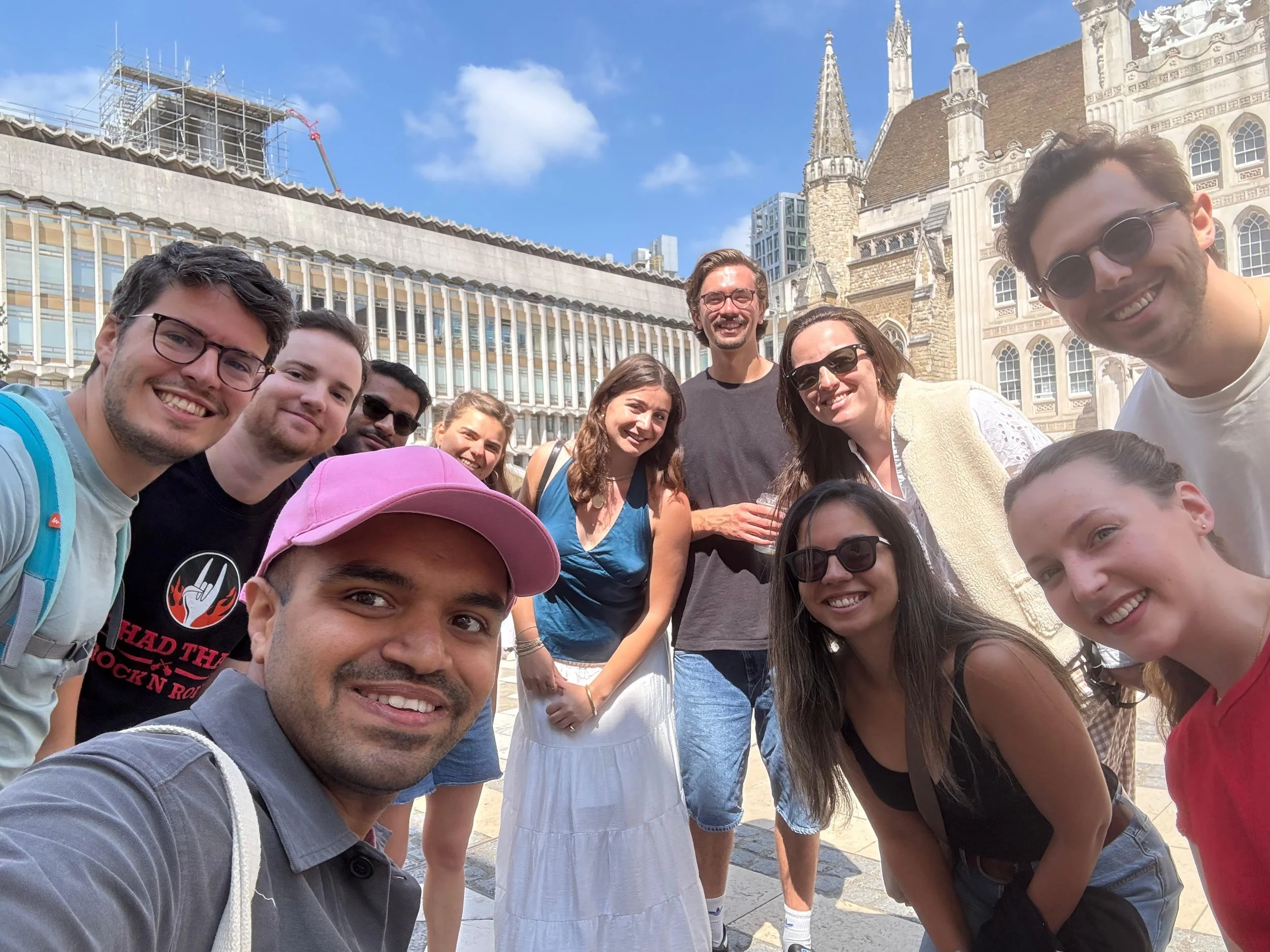 Off the beat Atlas Obscura adventure seekers smiling for a selfie outside London Guildhall