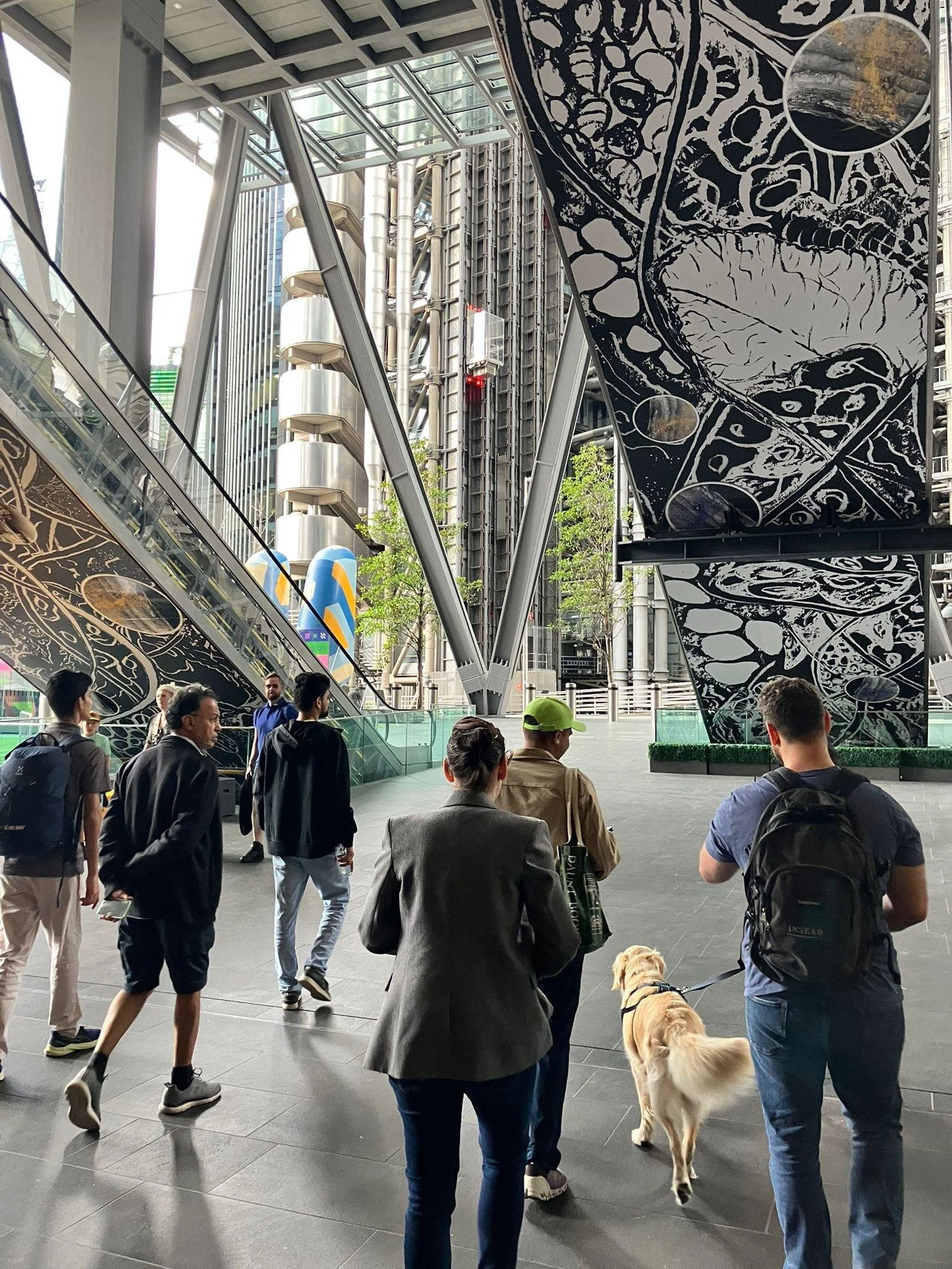 People walking towards Lloyd's building to explore its history, East India Company history in London