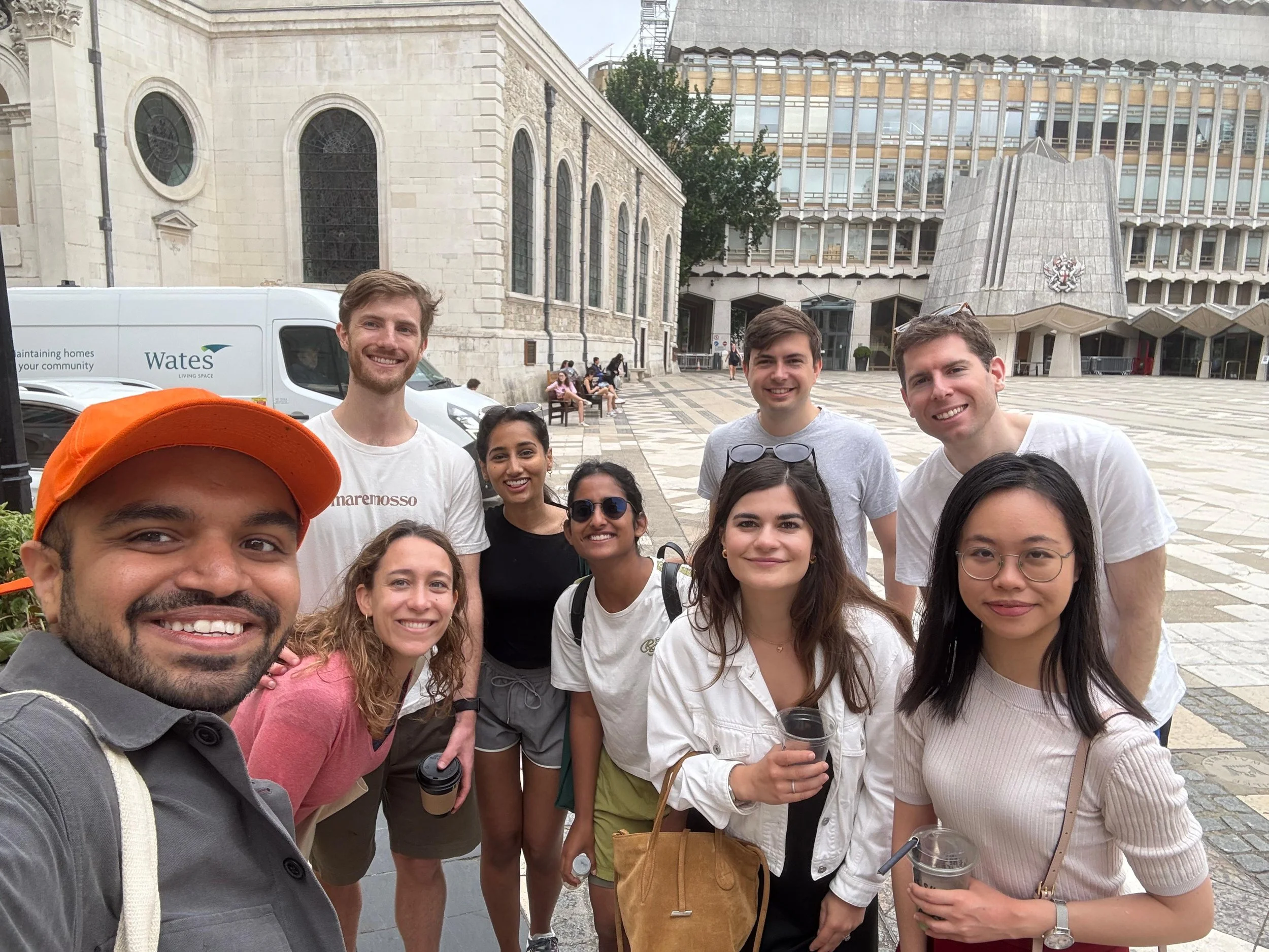 Off the beat Atlas Obscura adventure seekers smiling for a selfie outside London Guildhall after exploring British Empire's economic History