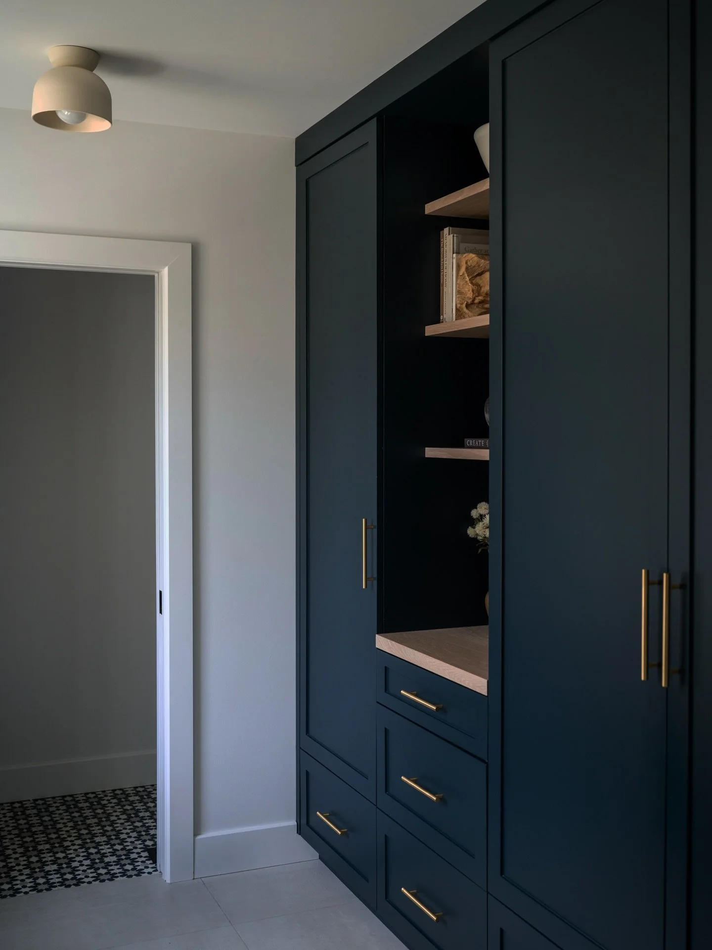 STOP. Six years old and still holding strong. 

This was one of our favourite projects from way back and honestly&hellip;she&rsquo;s aging better than most of us. That deep inky cabinetry, warm wood shelves, and brass details still hit just as hard t