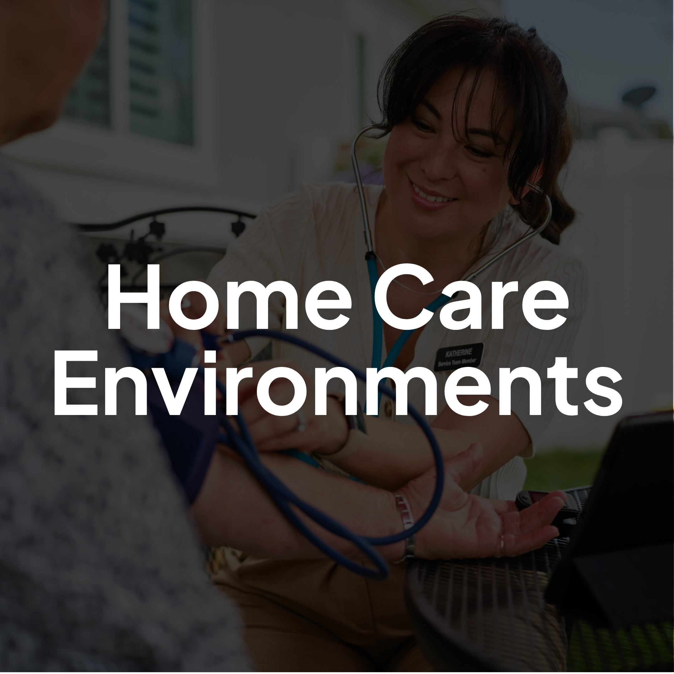 Home care professional providing in-home support to an older adult patient in a residential environment.