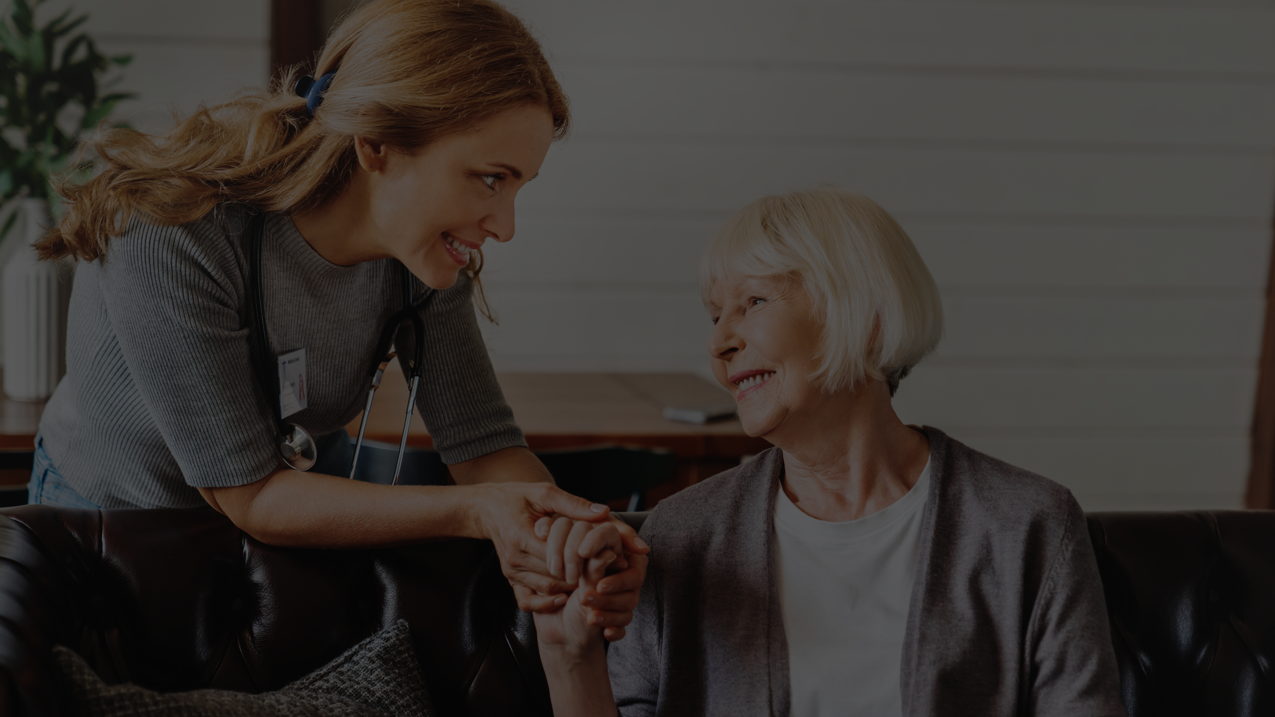 a senior living consultant helping a senior lady discussing accreditation gap analysis