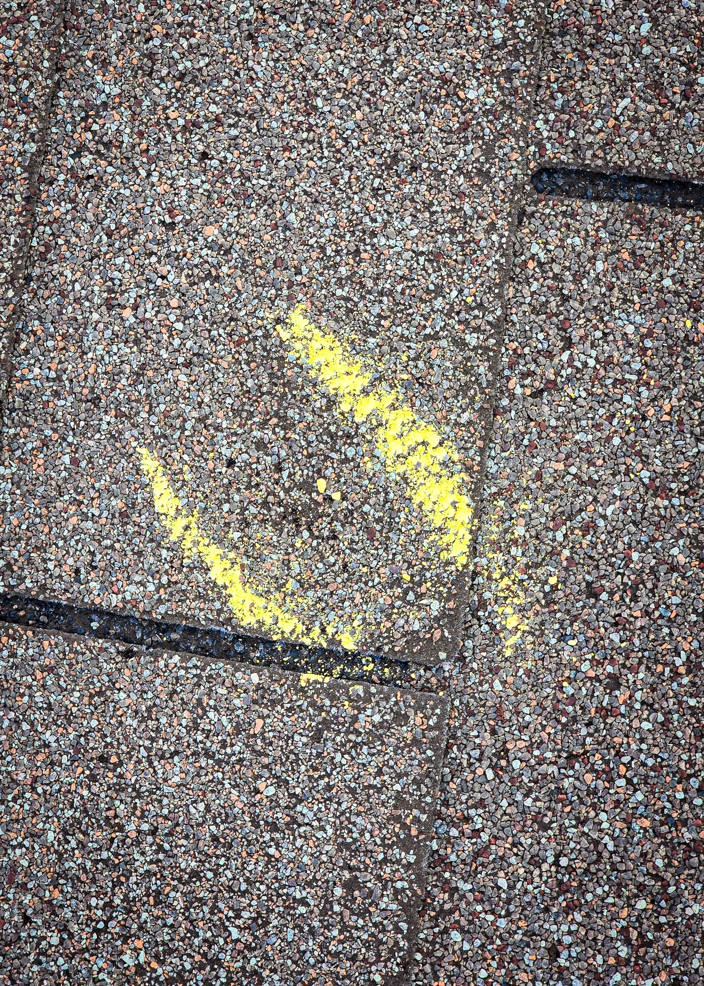 Hail impact. Hail damage. Hail to the roof. Hail damage to shingles.