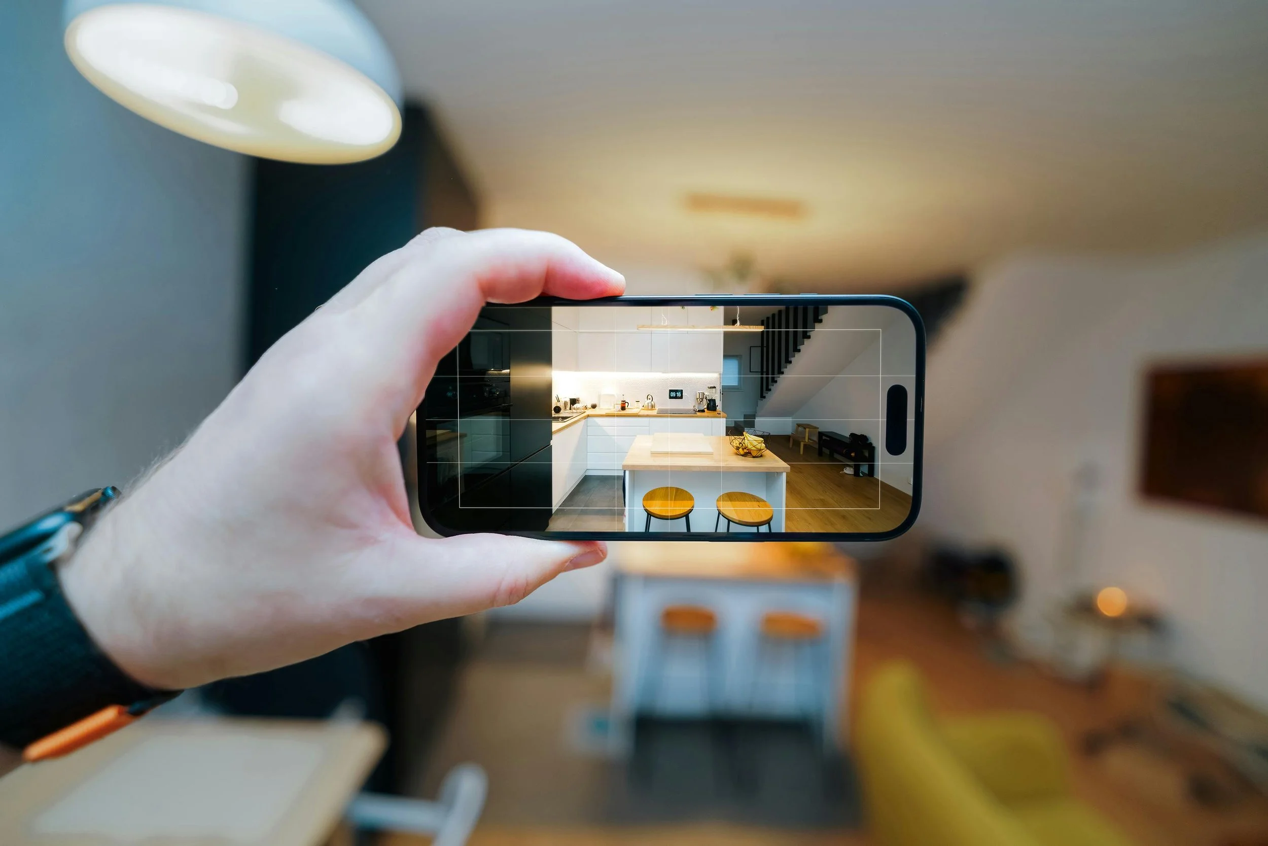 Photo by Jakub Zerdzicki: https://www.pexels.com/photo/smartphone-capturing-modern-kitchen-interior-30332467/