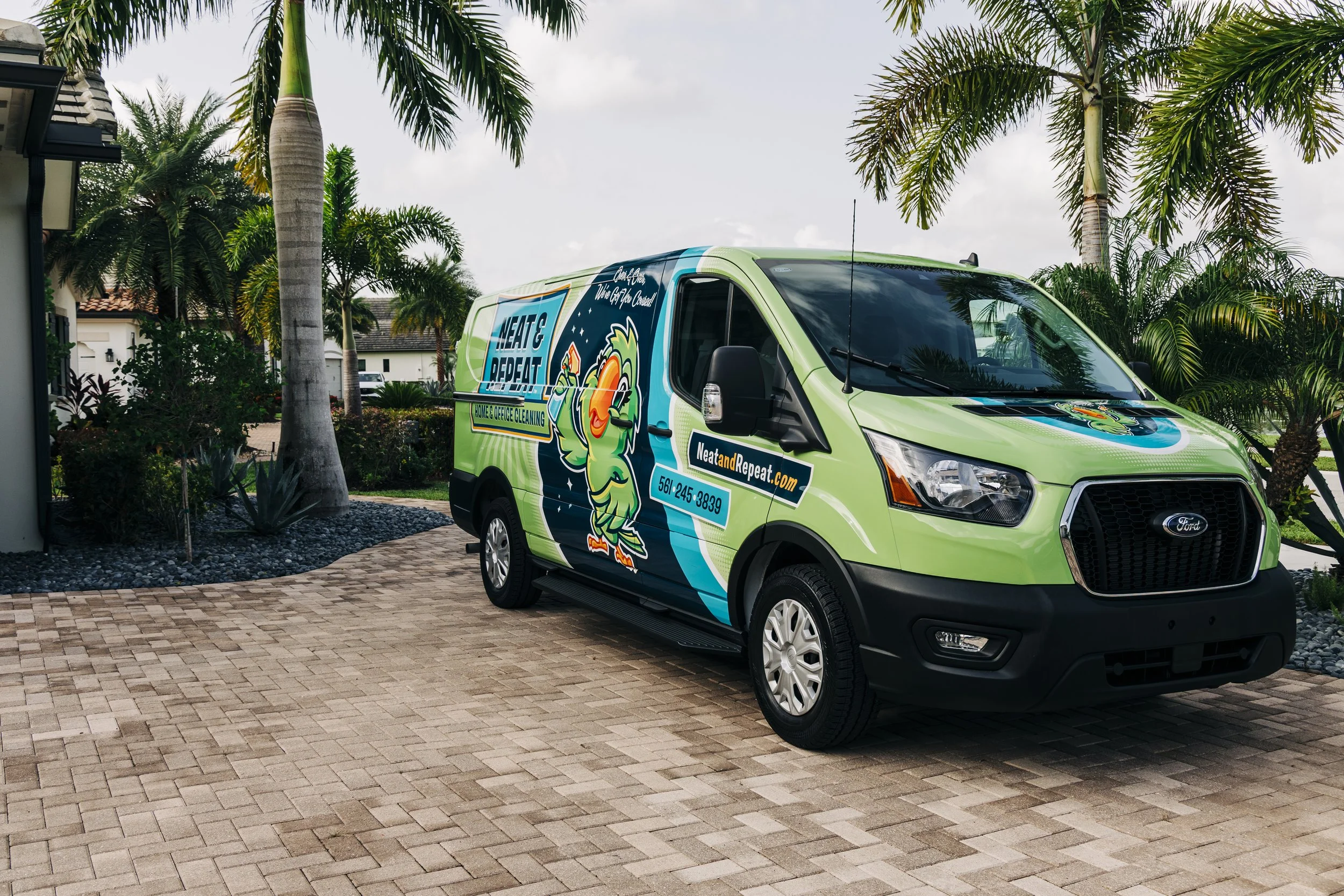 Neat and Repeat Cleaning van parked in a residential driveway