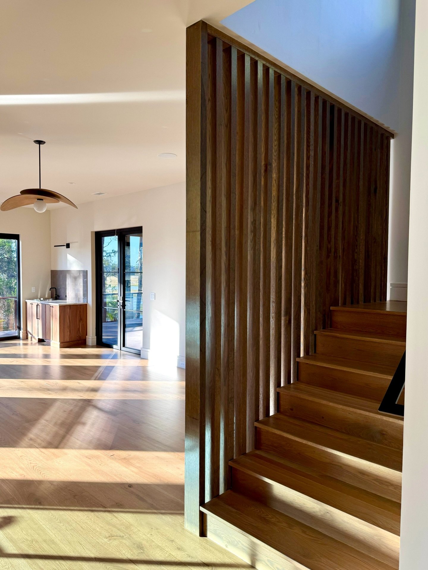 Handcrafted slat paneling that transforms a staircase into an architectural feature! Refined, intentional, and timeless.✨

#custom #carpentry #charlestonbuilders