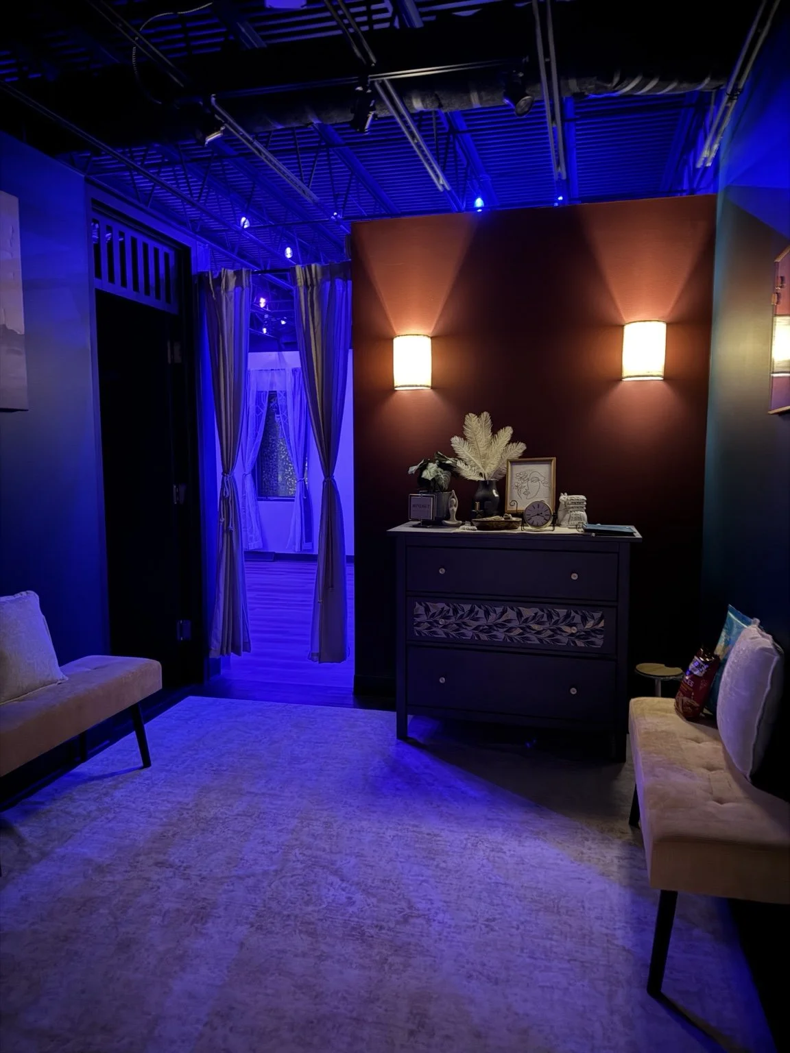 Burgundy lounge and entrance at Embodi Wellness Studio in Hudson, Wisconsin