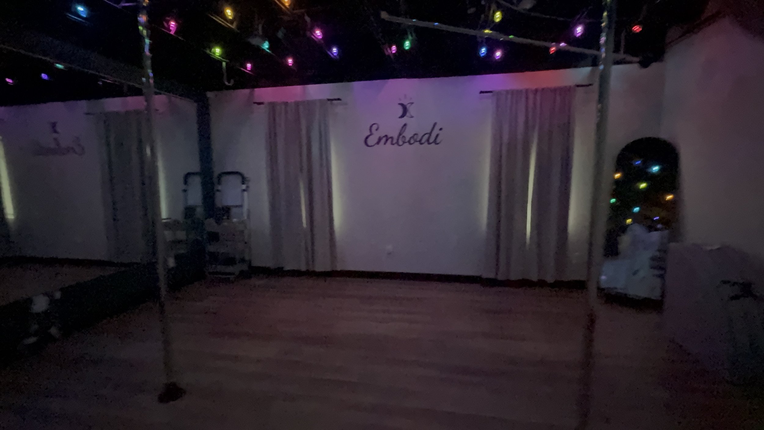 Pole studio with colorful lighting at Embodi Wellness Studio in Hudson, Wisconsin