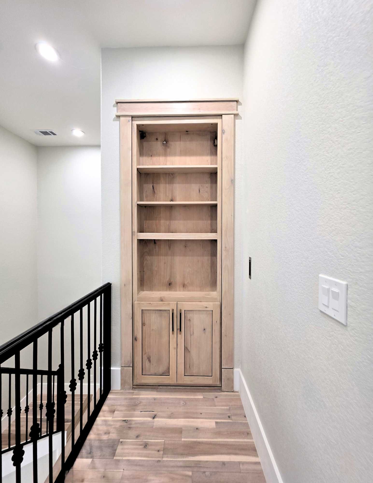 Hidden doorway into Casita with custom shelves