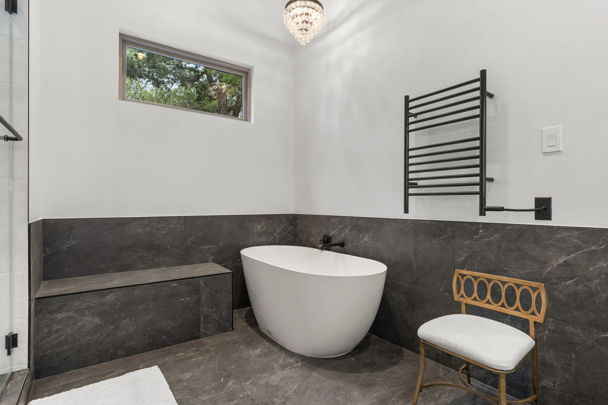 Custom bathroom remodel featuring Brazilian Carrara marble and sleek modern finishes.