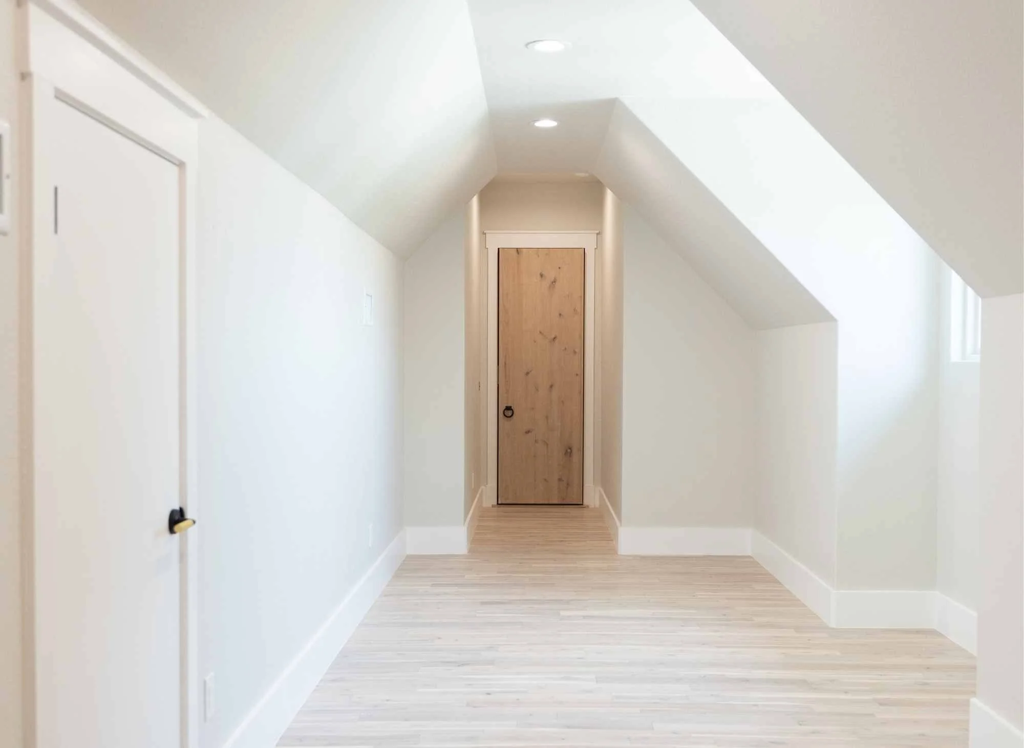 Breezeway between main home and casita with hardwood floors, faulted ceilings and attic storage
