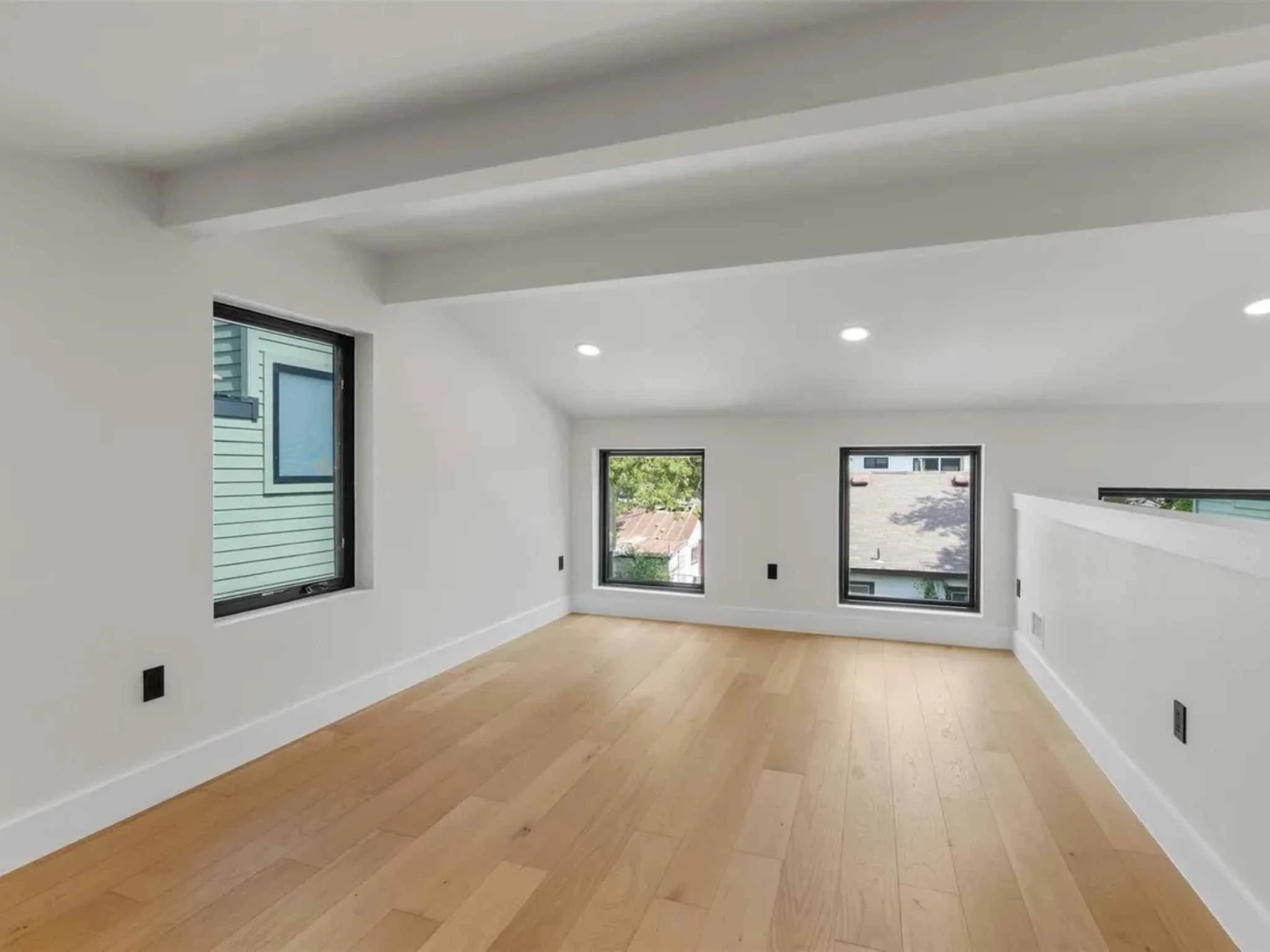 Open loft area in a downtown Austin custom home by Atria Design and Build.