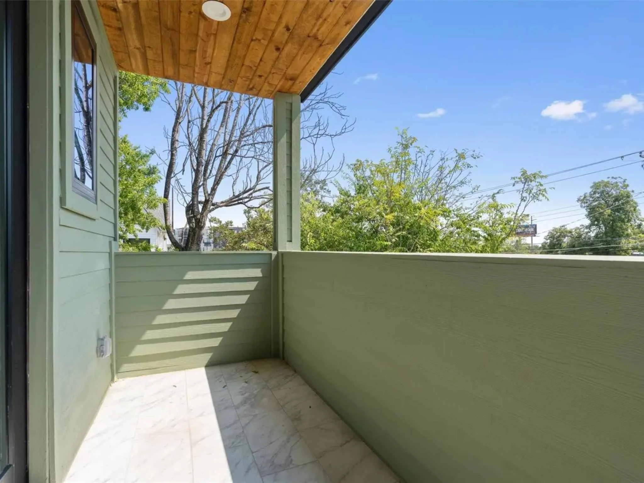Downtown Austin custom home exterior balcony by Atria Design and Build.